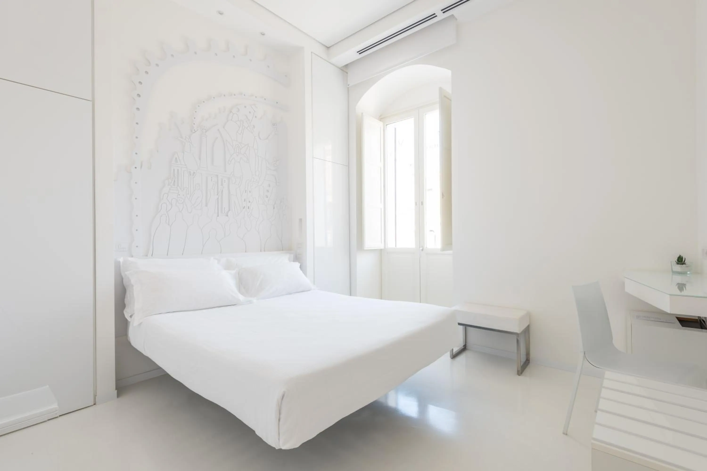 Bed in Vittorio Veneto Matera Luxury Rooms