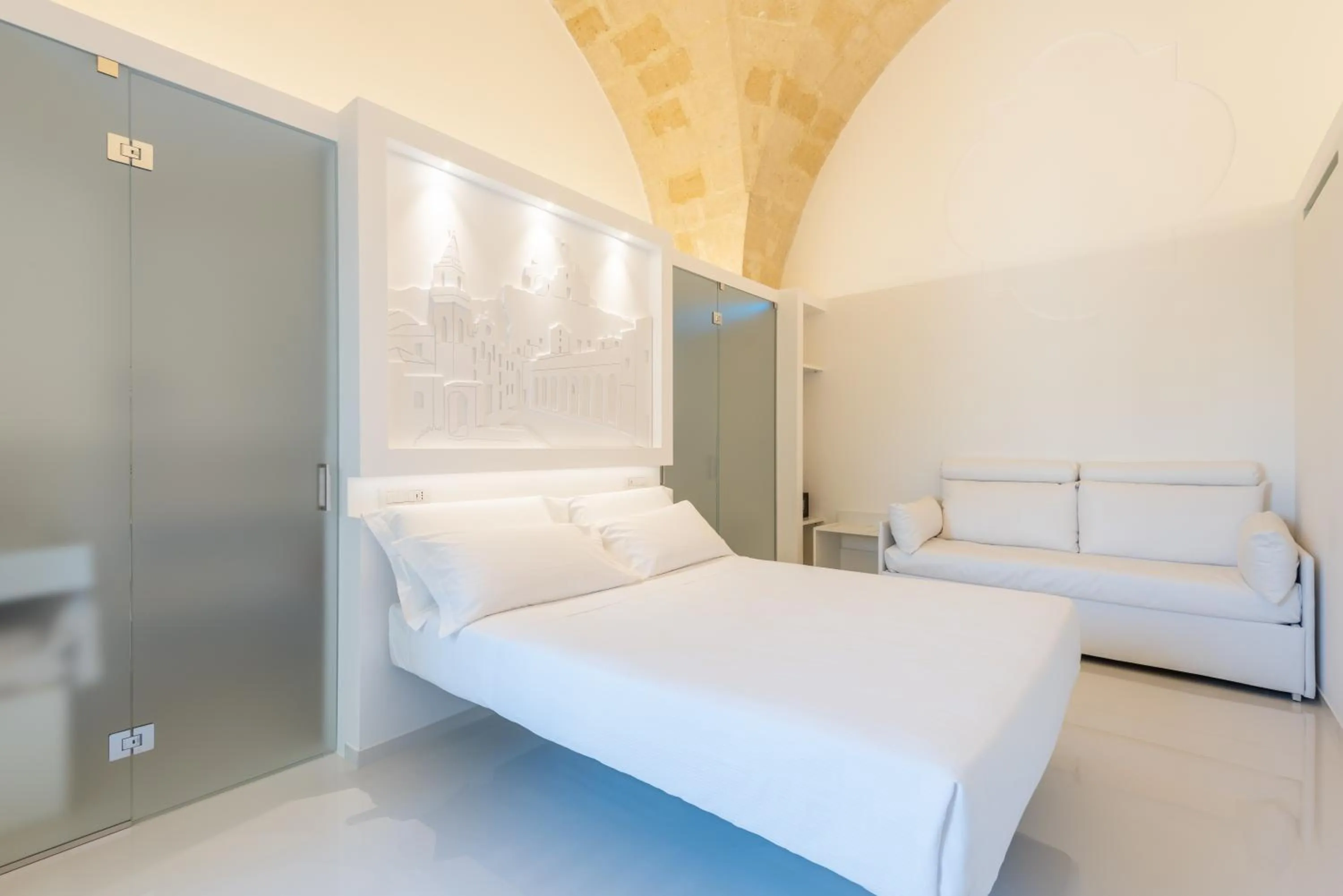 Bed in Vittorio Veneto Matera Luxury Rooms