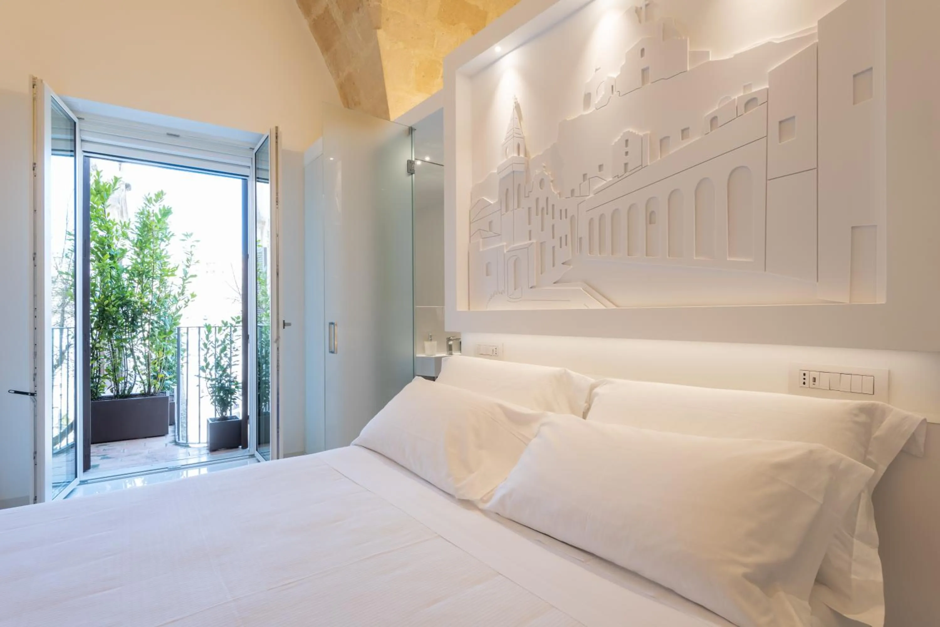 Bed in Vittorio Veneto Matera Luxury Rooms