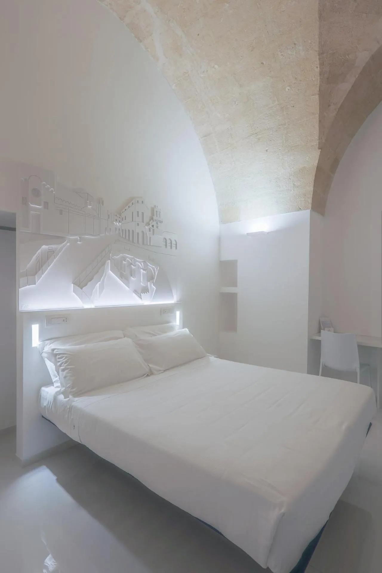 Bed in Vittorio Veneto Matera Luxury Rooms