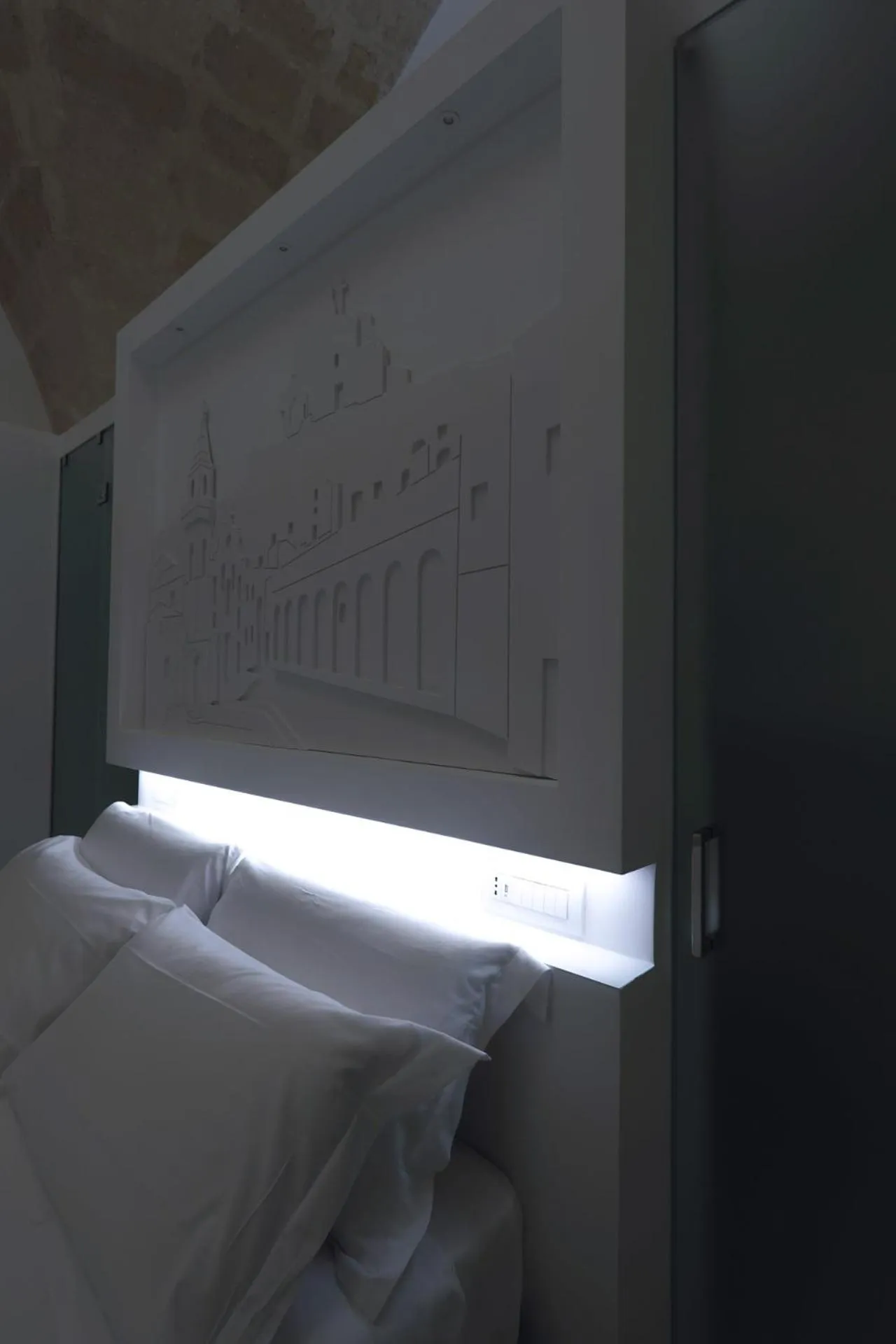 Bed in Vittorio Veneto Matera Luxury Rooms