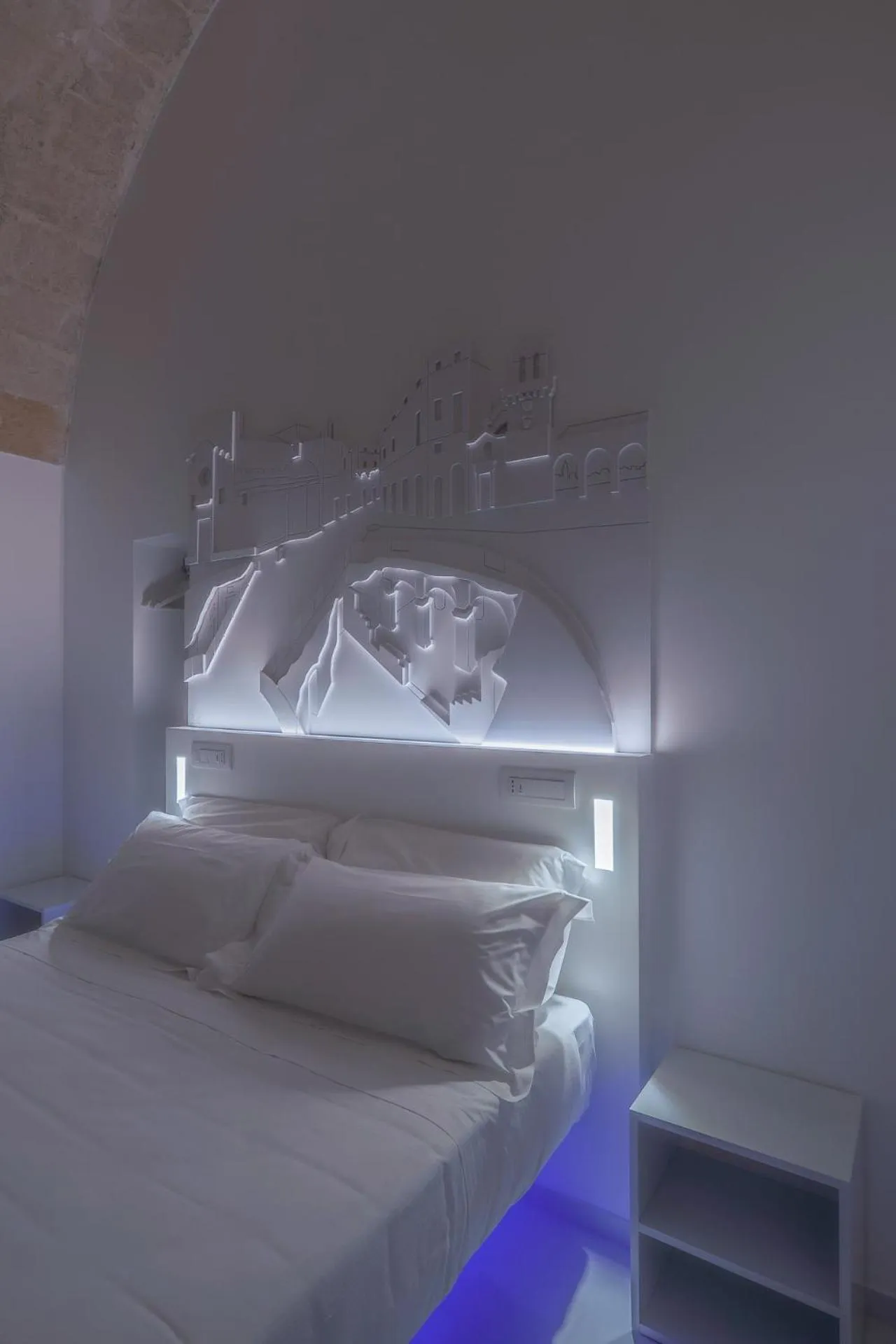 Bed in Vittorio Veneto Matera Luxury Rooms