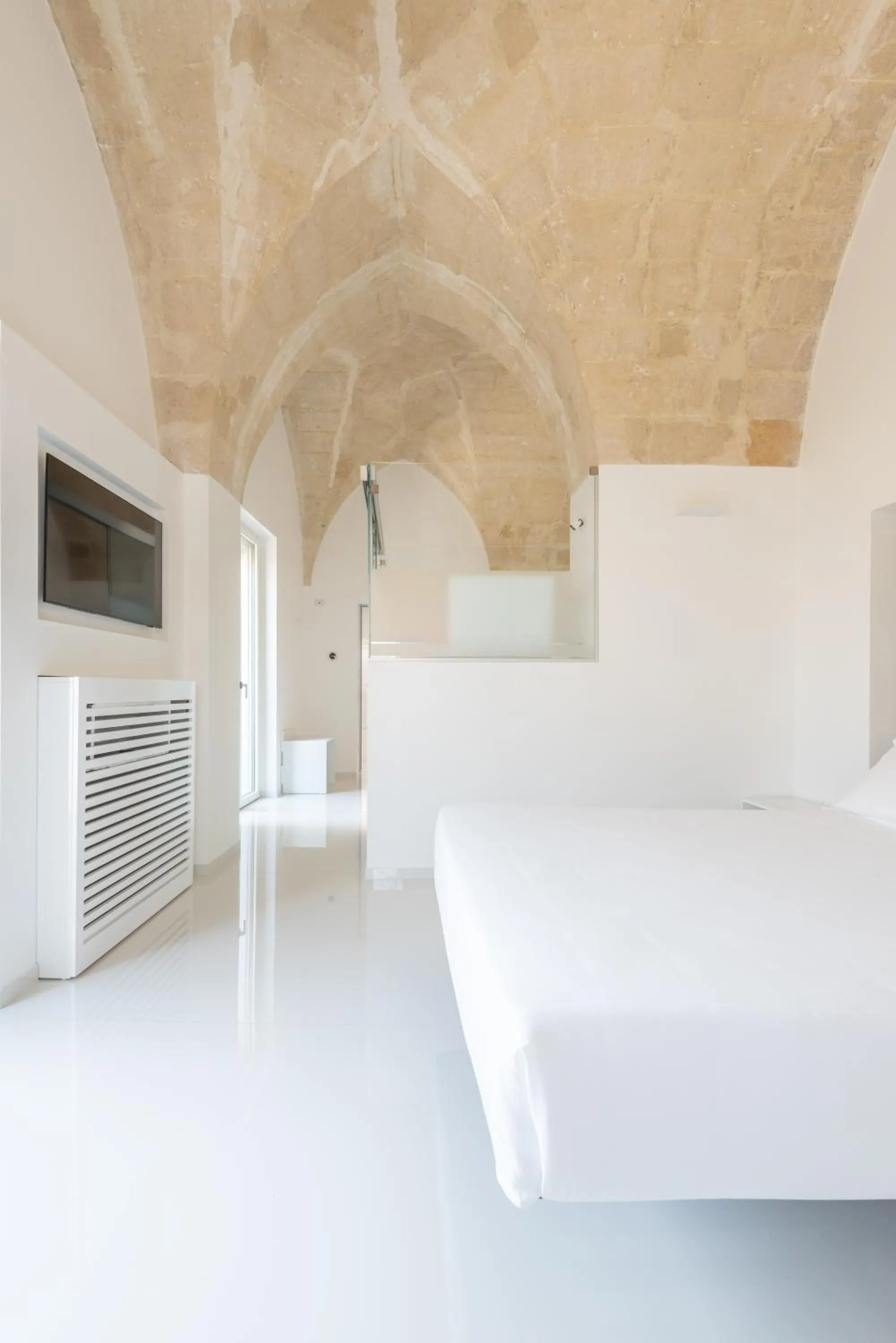 Bed in Vittorio Veneto Matera Luxury Rooms