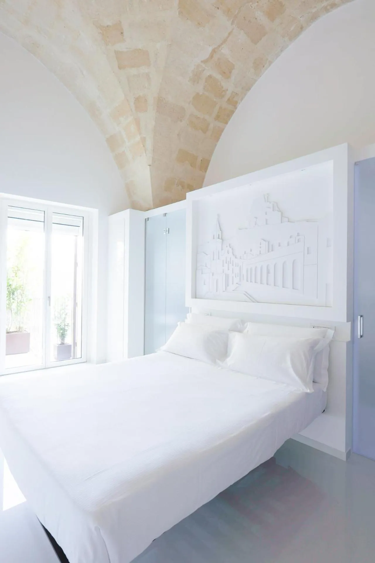 Bed in Vittorio Veneto Matera Luxury Rooms