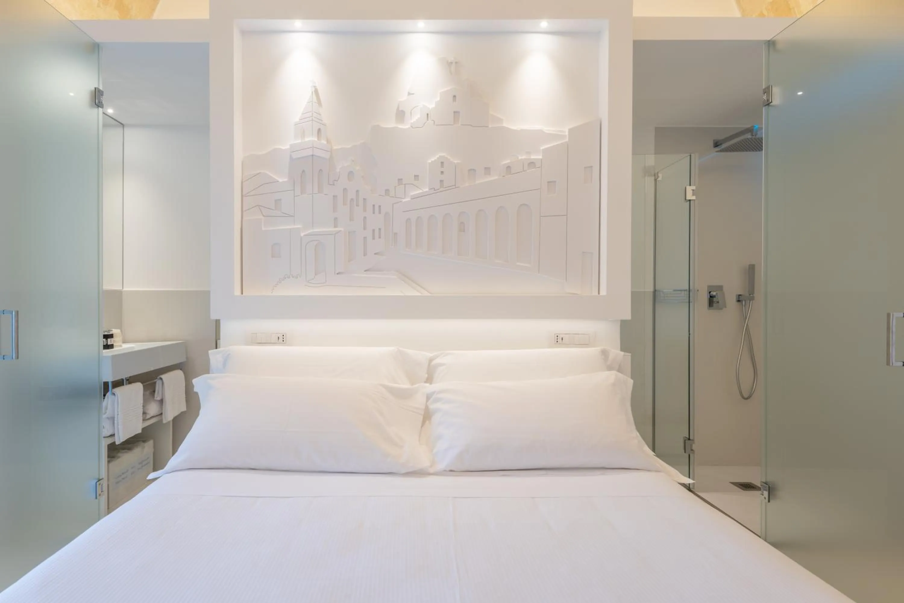 Bed in Vittorio Veneto Matera Luxury Rooms