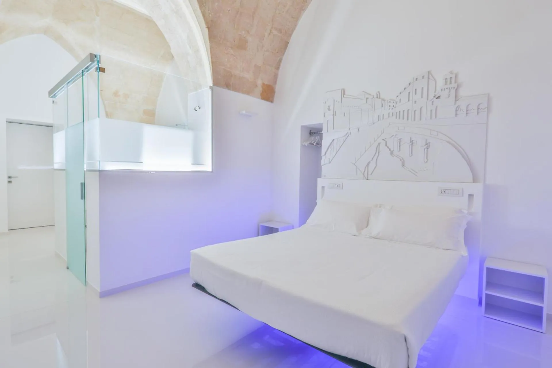 Bed in Vittorio Veneto Matera Luxury Rooms