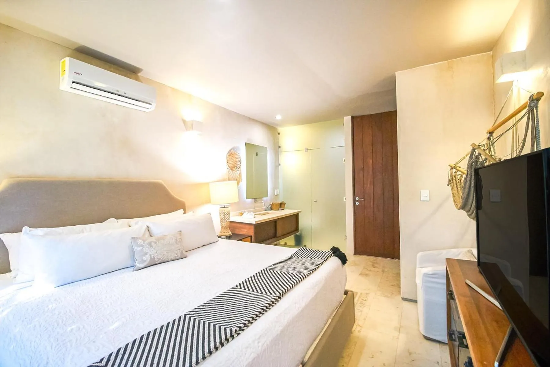 Bed in Eco-chic Design Condos Wrapped in Nature's Elements by Stella Rentals