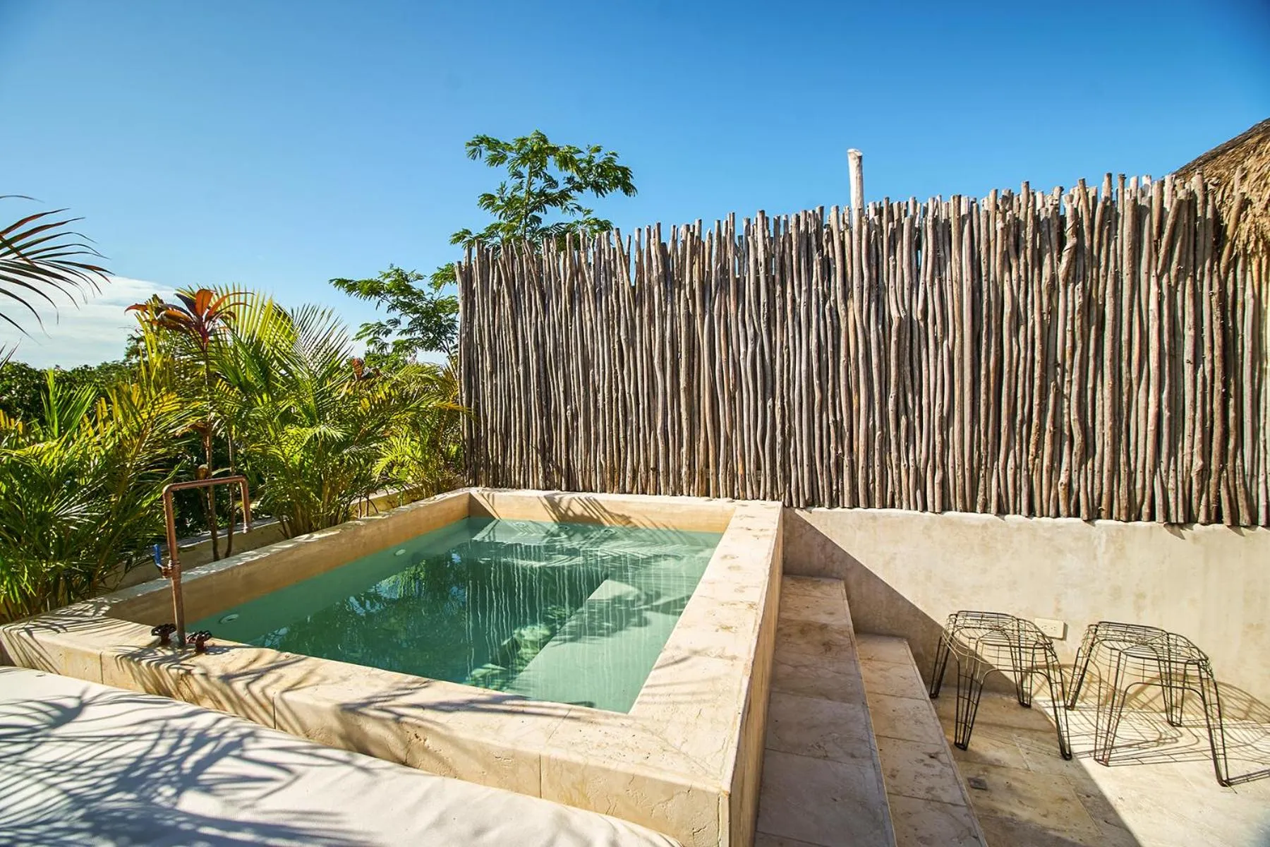 Balcony/Terrace in Eco-chic Design Condos Wrapped in Nature's Elements by Stella Rentals