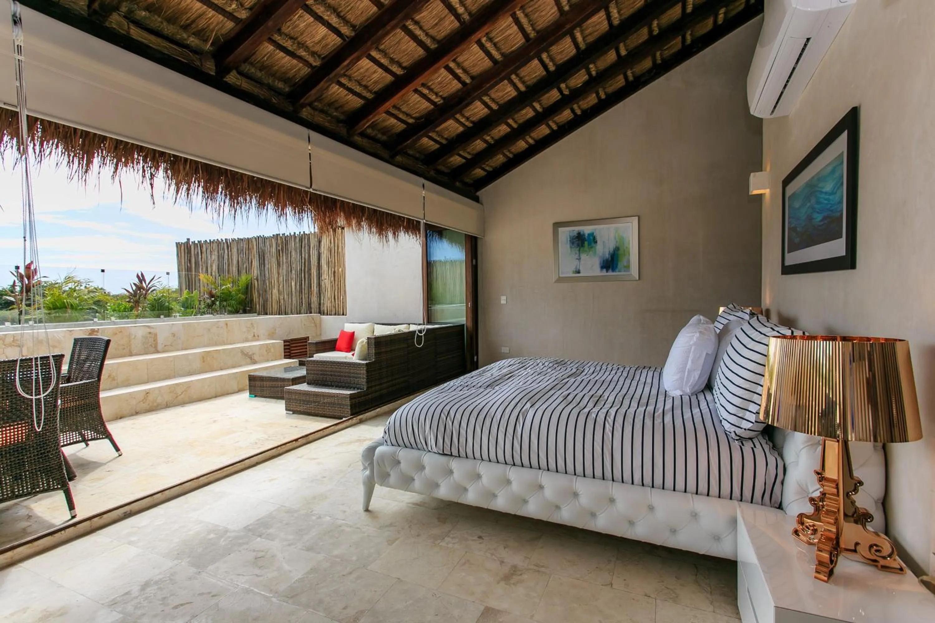 Balcony/Terrace, Bed in Eco-chic Design Condos Wrapped in Nature's Elements by Stella Rentals
