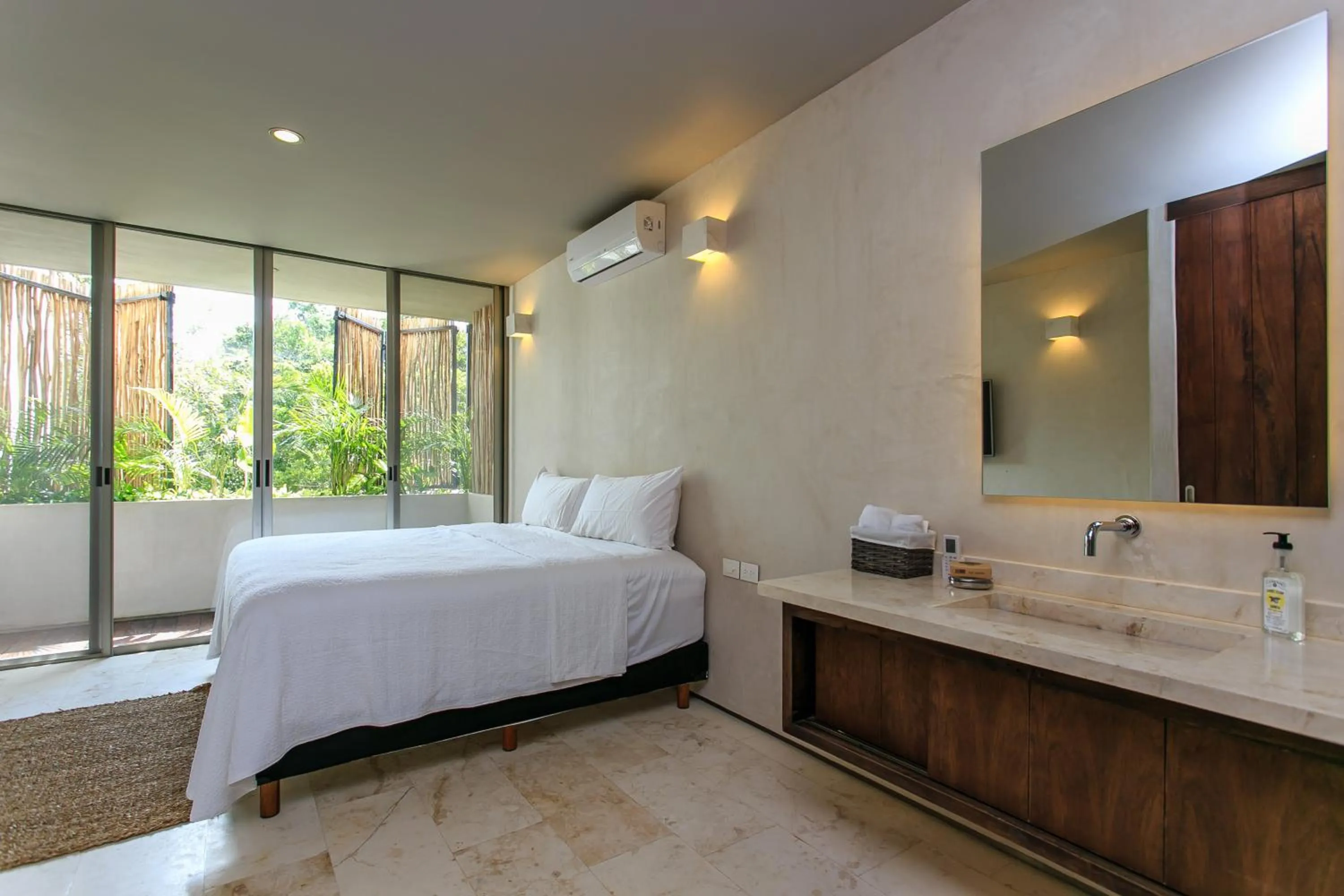 Bathroom, Bed in Eco-chic Design Condos Wrapped in Nature's Elements by Stella Rentals