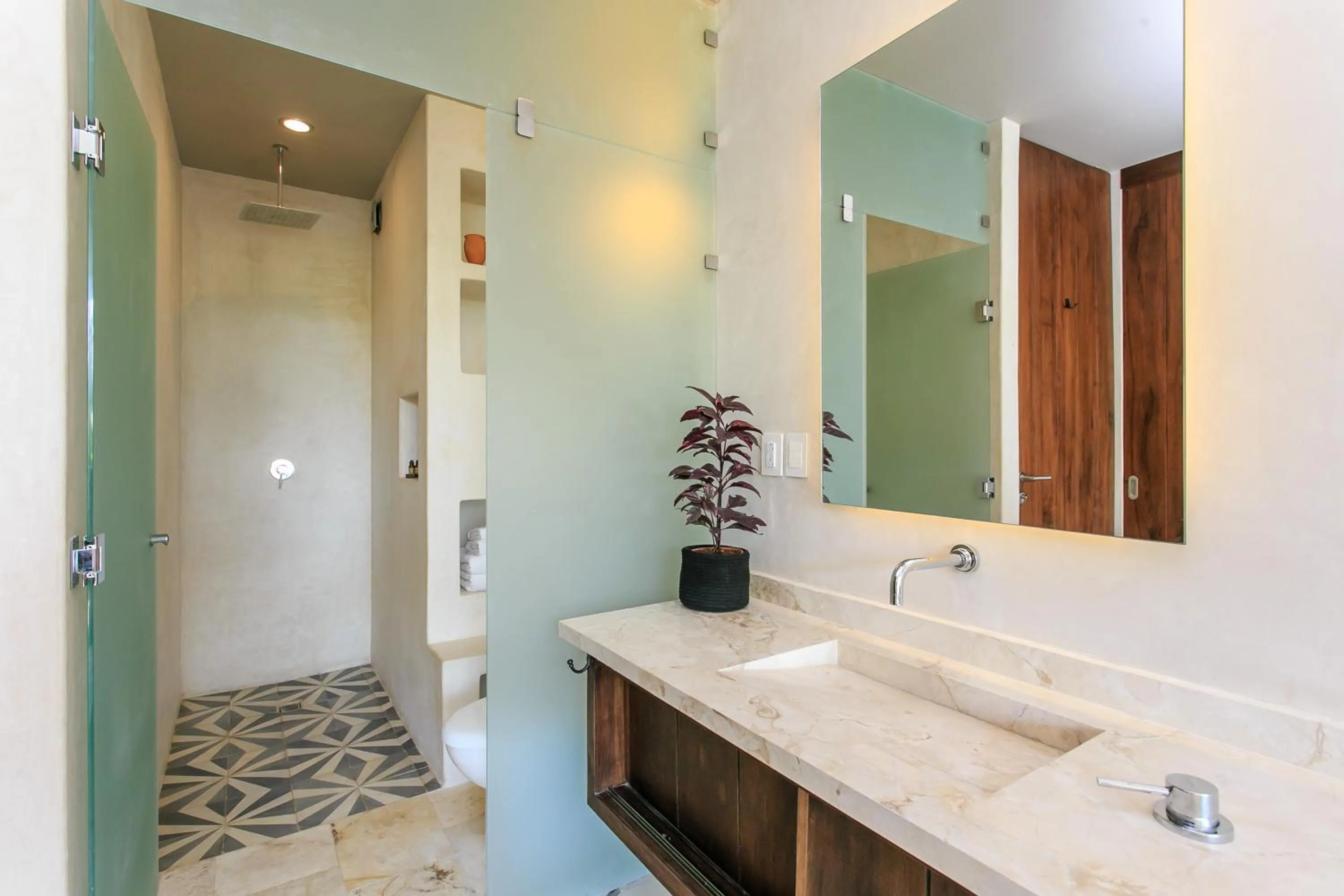 Bathroom in Eco-chic Design Condos Wrapped in Nature's Elements by Stella Rentals