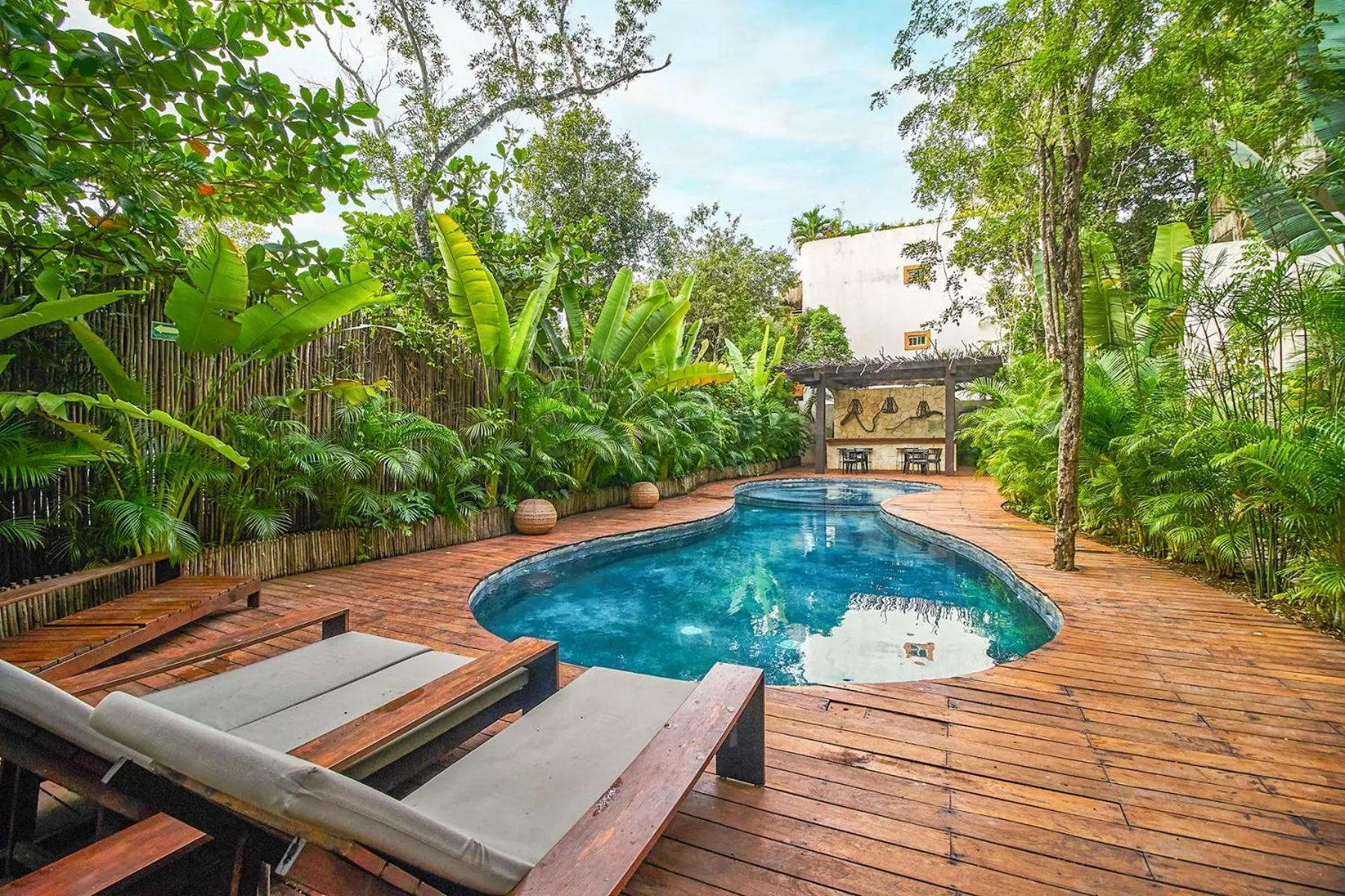 Swimming pool in Eco-chic Design Condos Wrapped in Nature's Elements by Stella Rentals