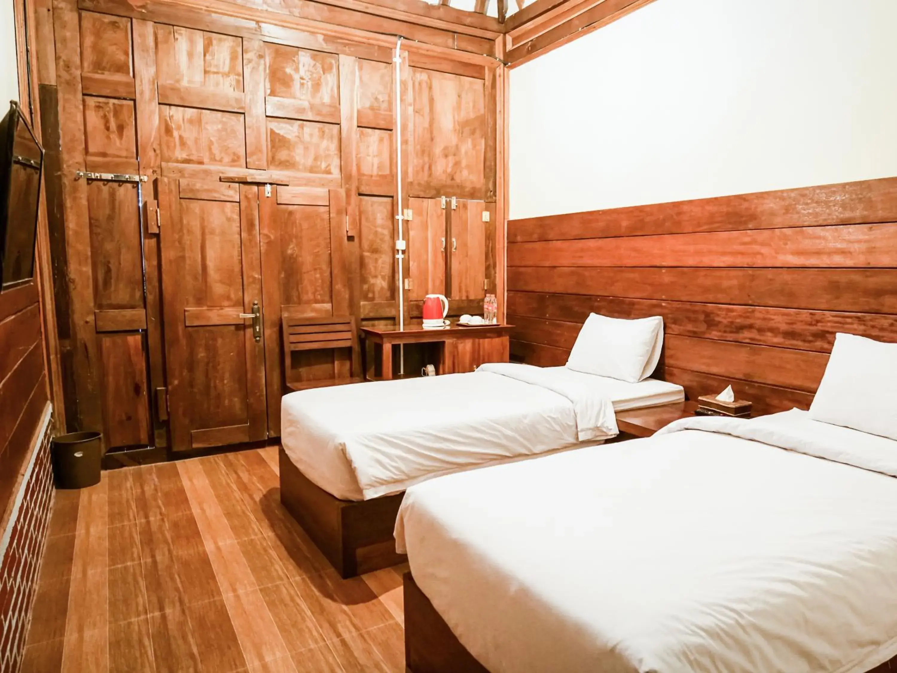 Bed in Pendhapa Art Space - PAS Limasan Homestay Bed in Pendhapa Art Space - PAS Limasan Homestay