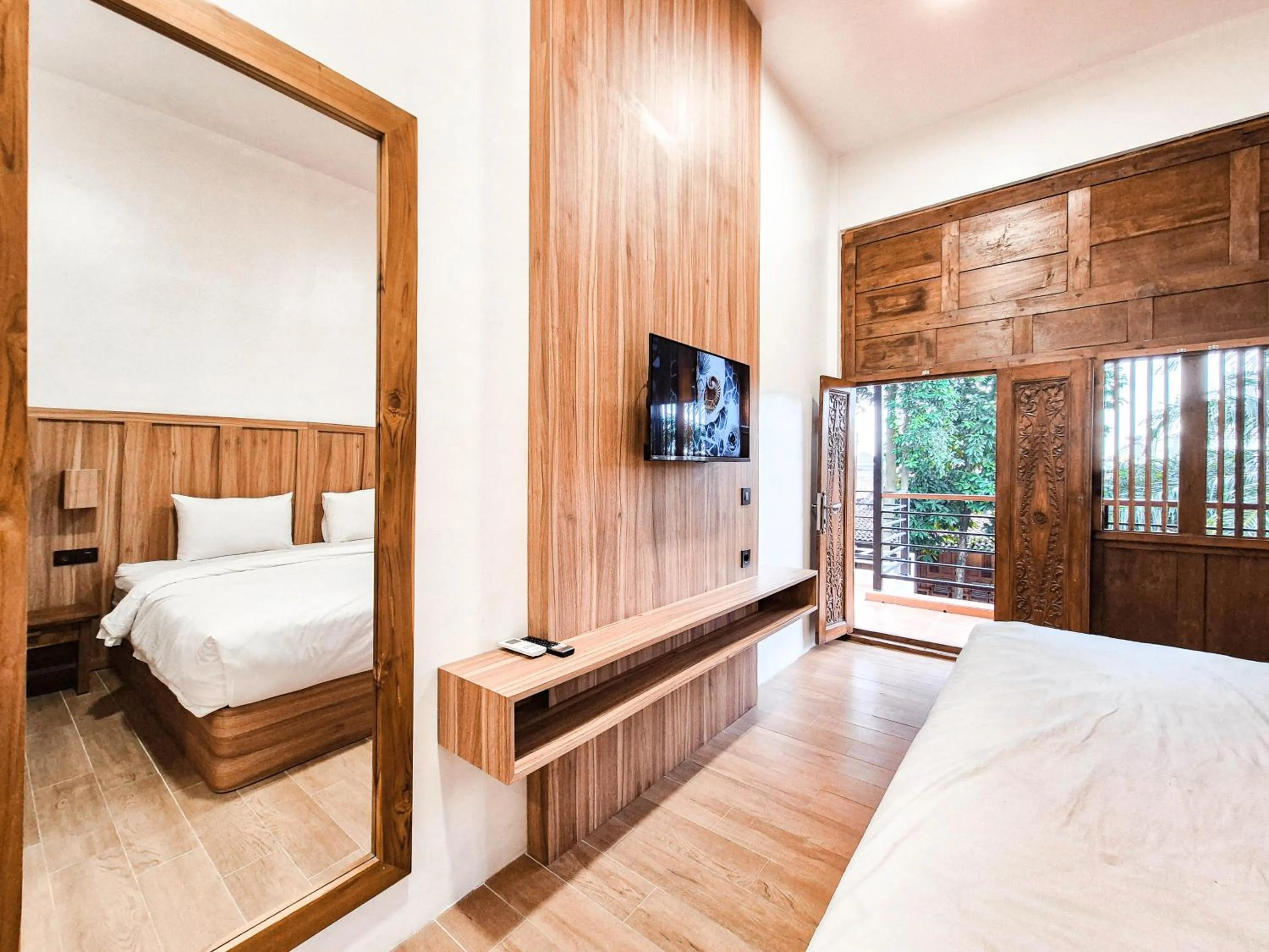 Bed in Pendhapa Art Space - PAS Limasan Homestay