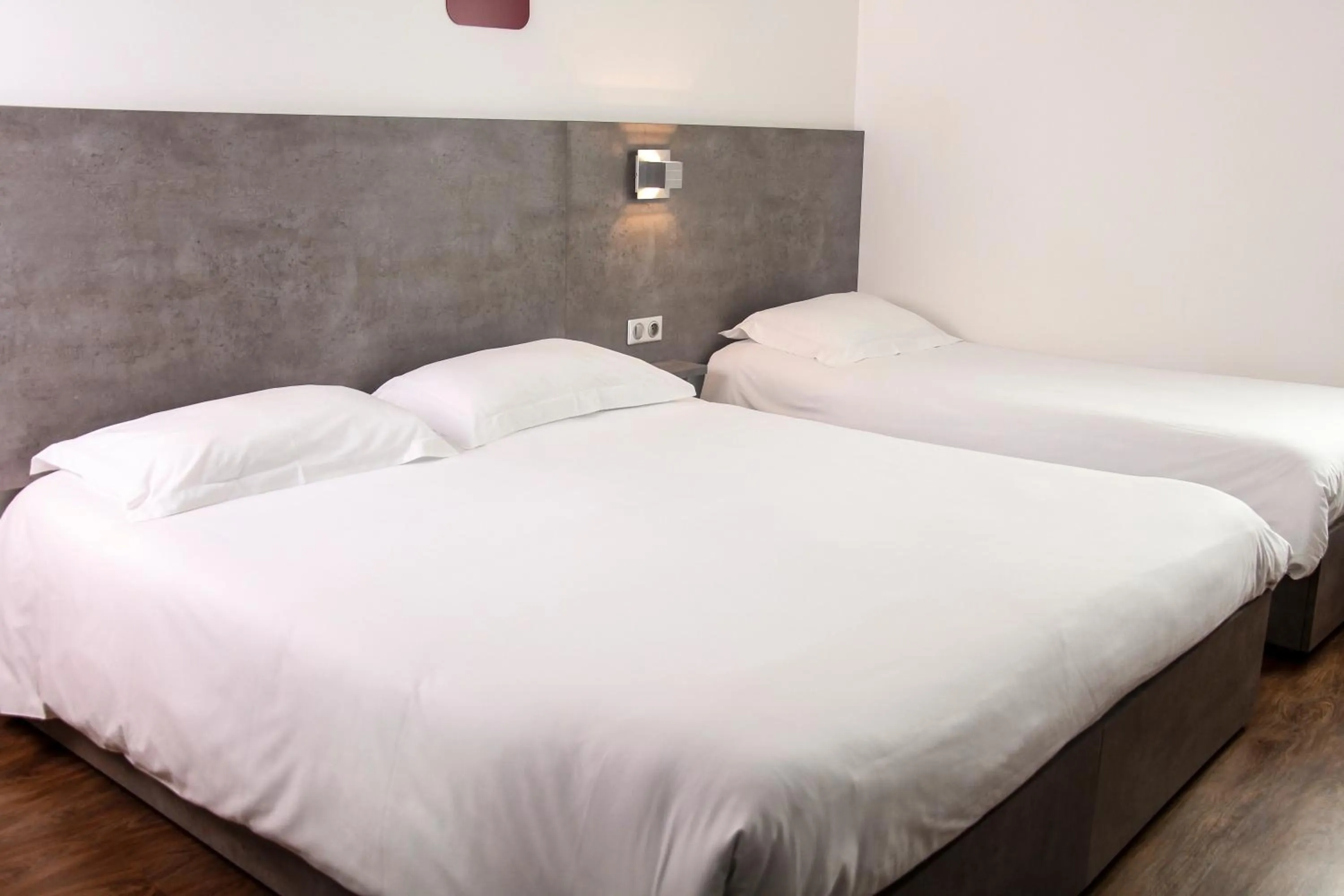 Bed in H24 HOTEL