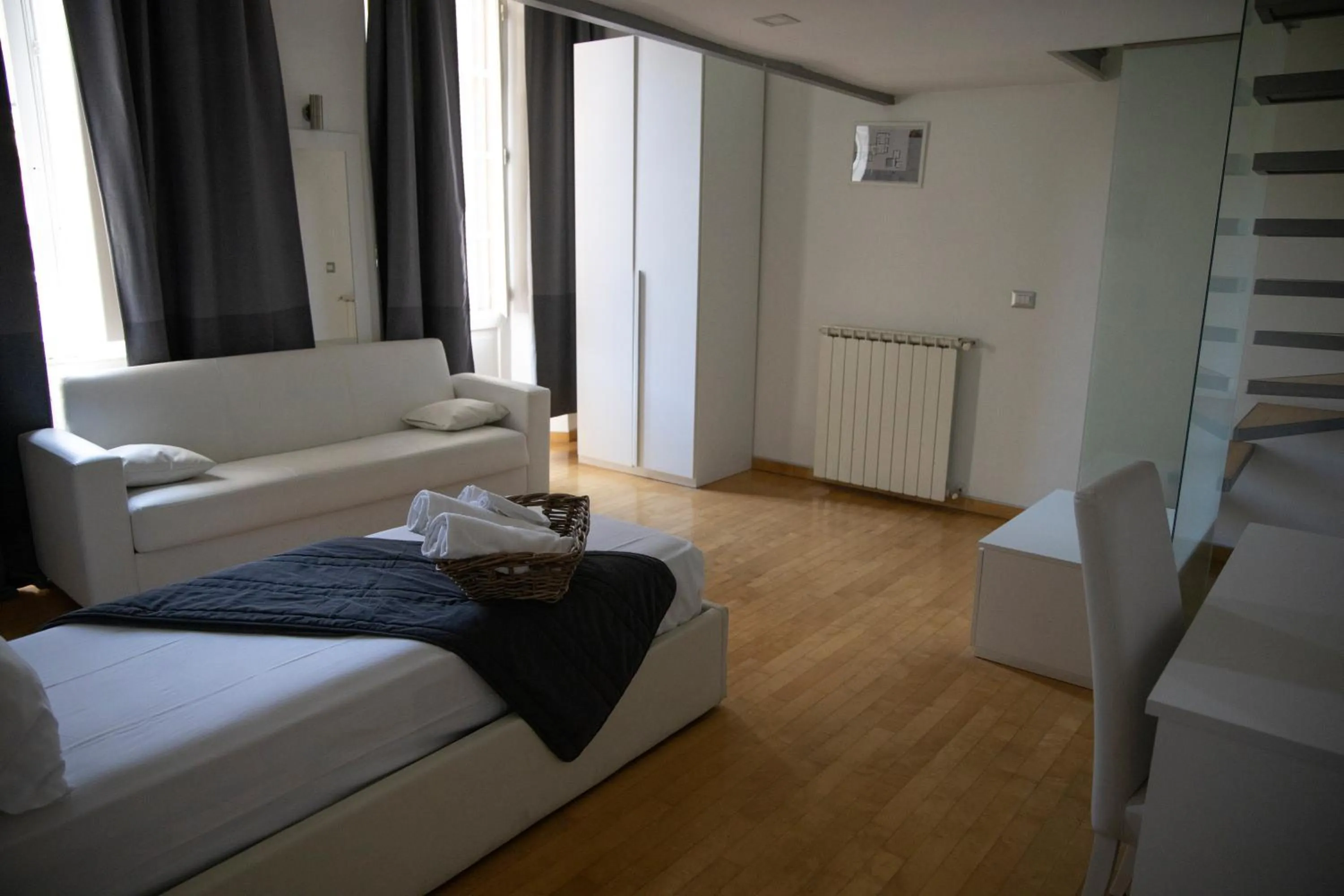 Photo of the whole room, Bed in Arch Rome Suites