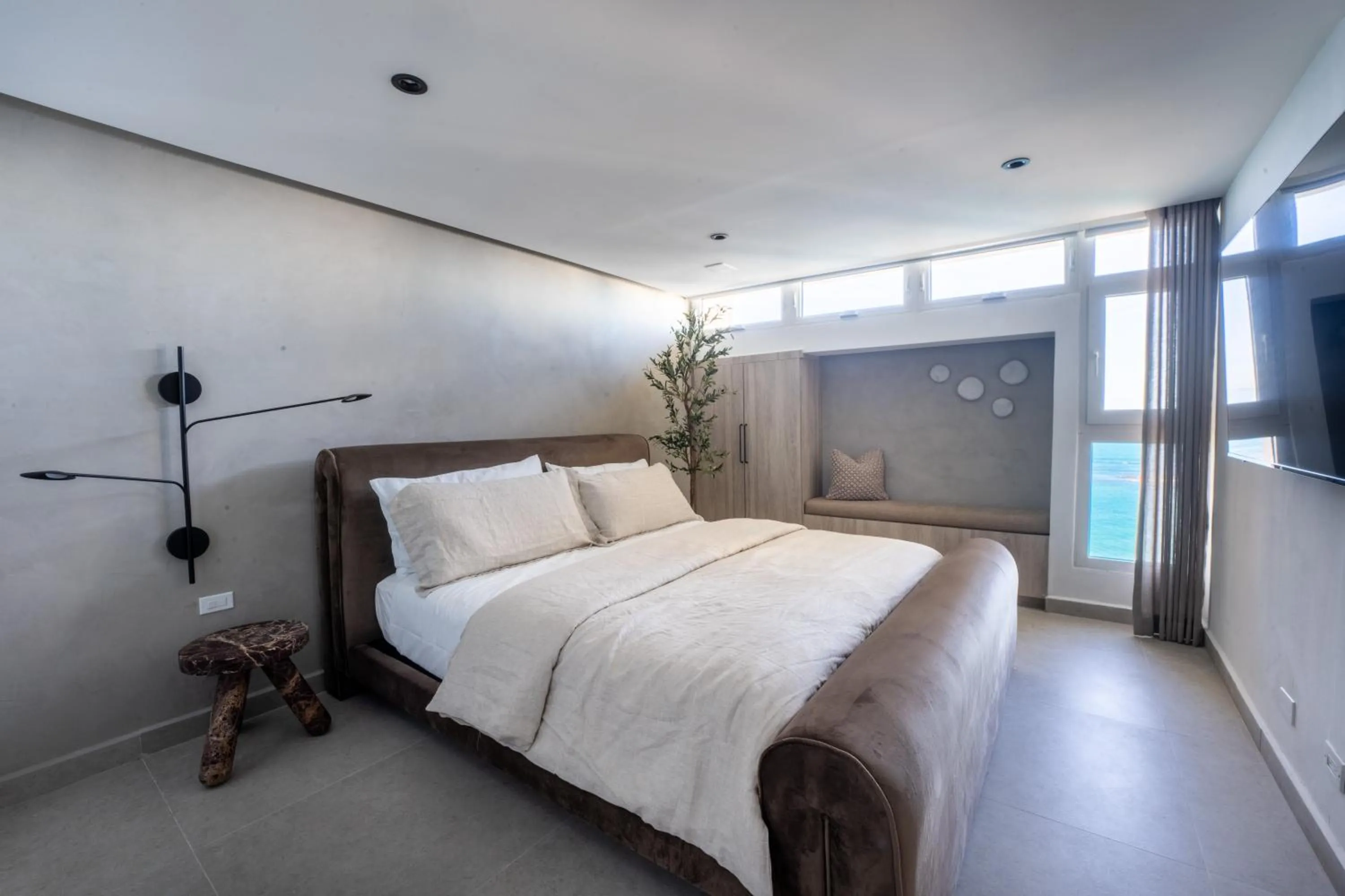 Bed in OCEAN VIEW DELUXE SUITE: PVT. BEACH & POOL