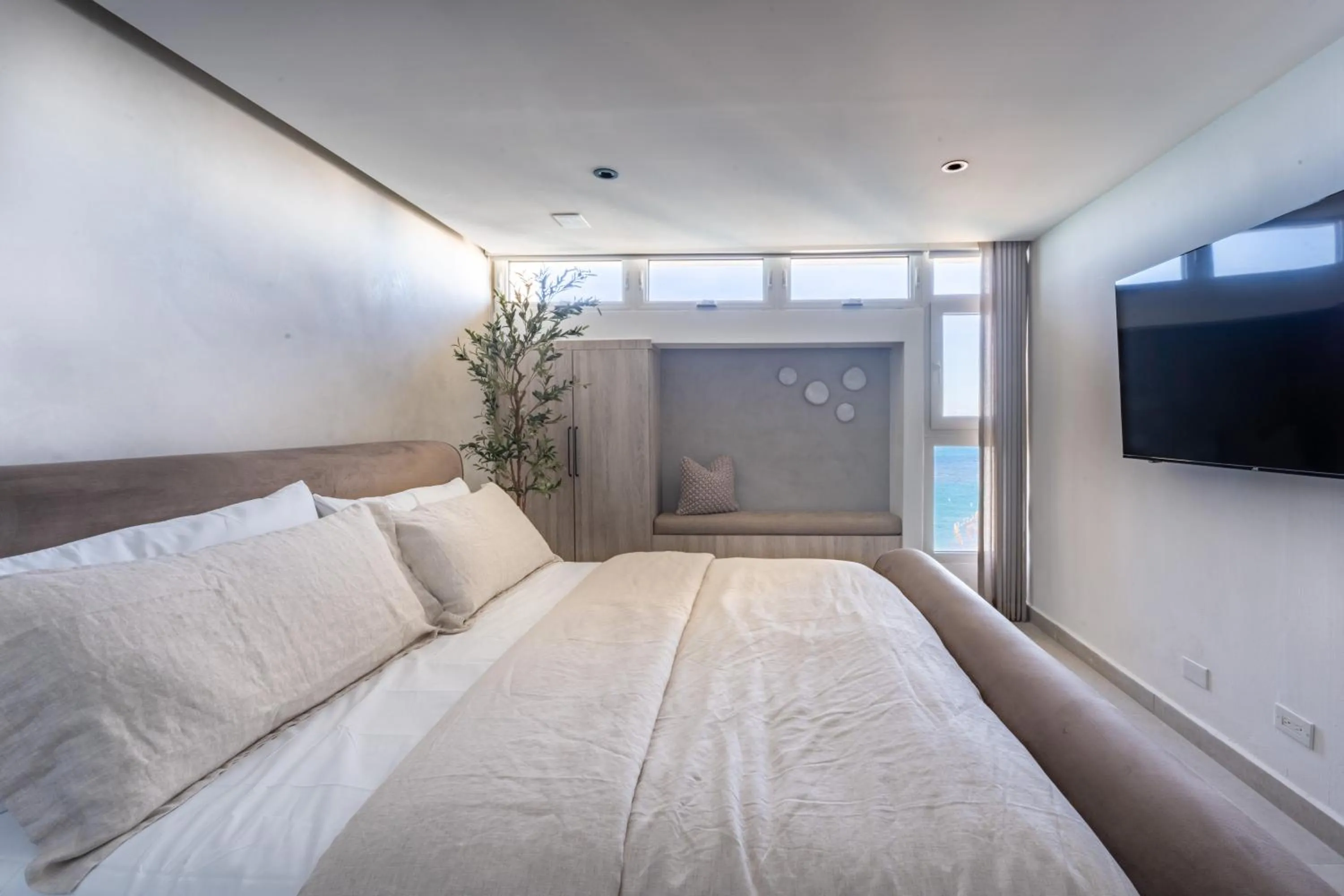 Bed in OCEAN VIEW DELUXE SUITE: PVT. BEACH & POOL