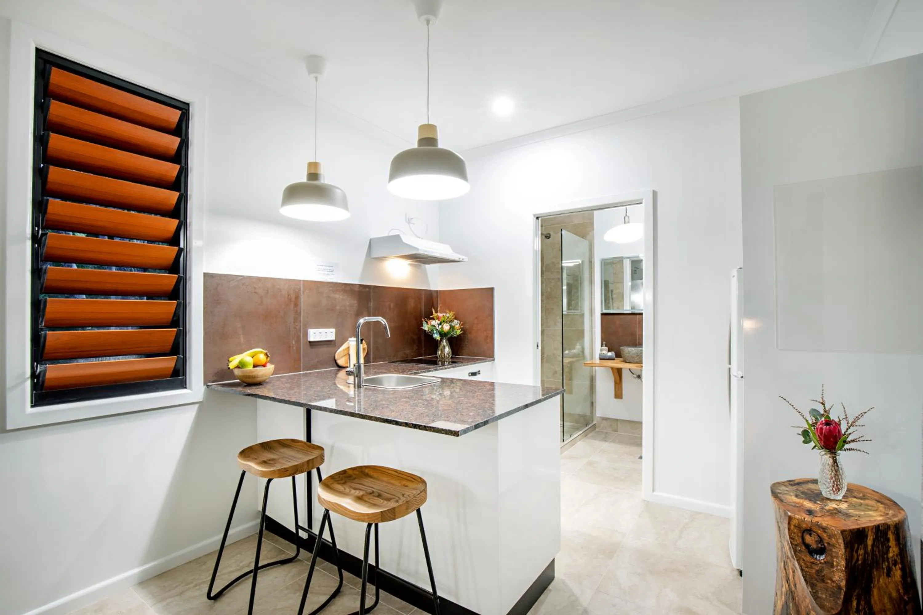 Kitchen or kitchenette in Airlie Beach Eco Cabins - Adults Only