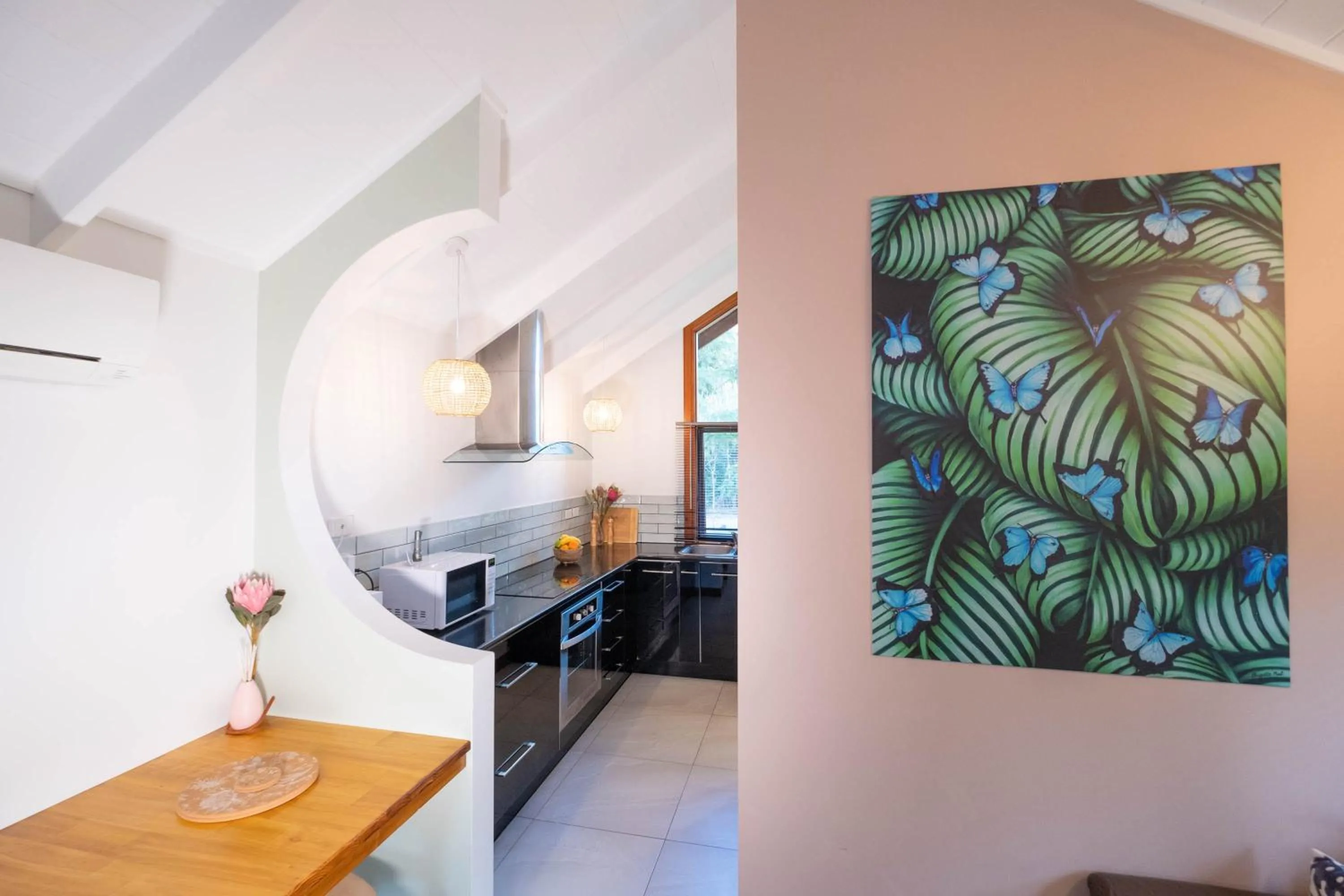 Kitchen or kitchenette in Airlie Beach Eco Cabins - Adults Only