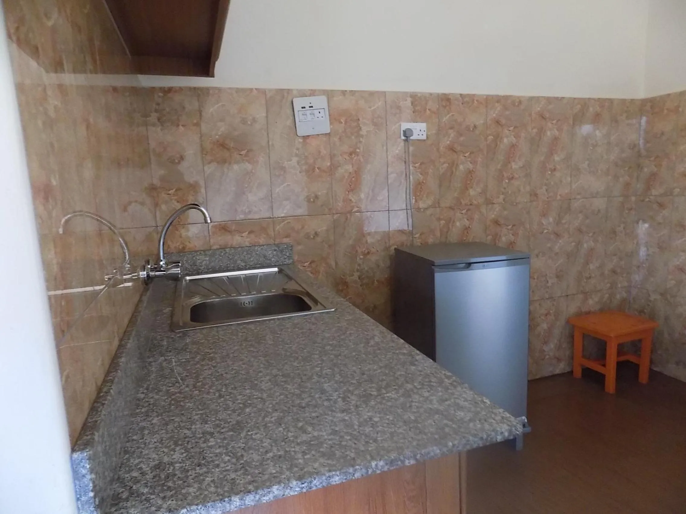 Kitchen or kitchenette in Olina Hotel and Apartments Kampala