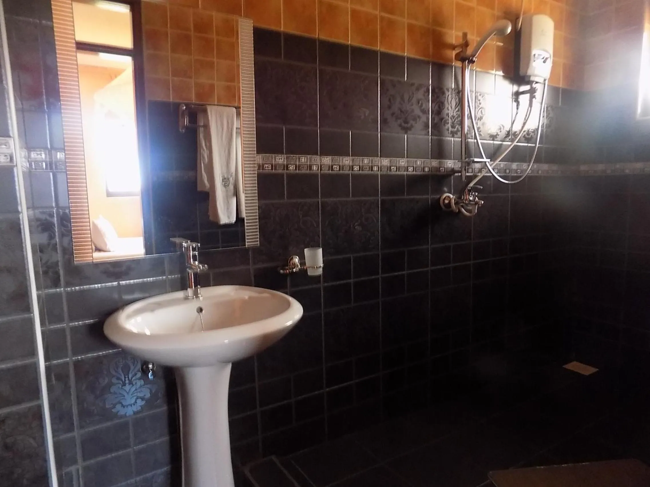 Bathroom in Olina Hotel and Apartments Kampala