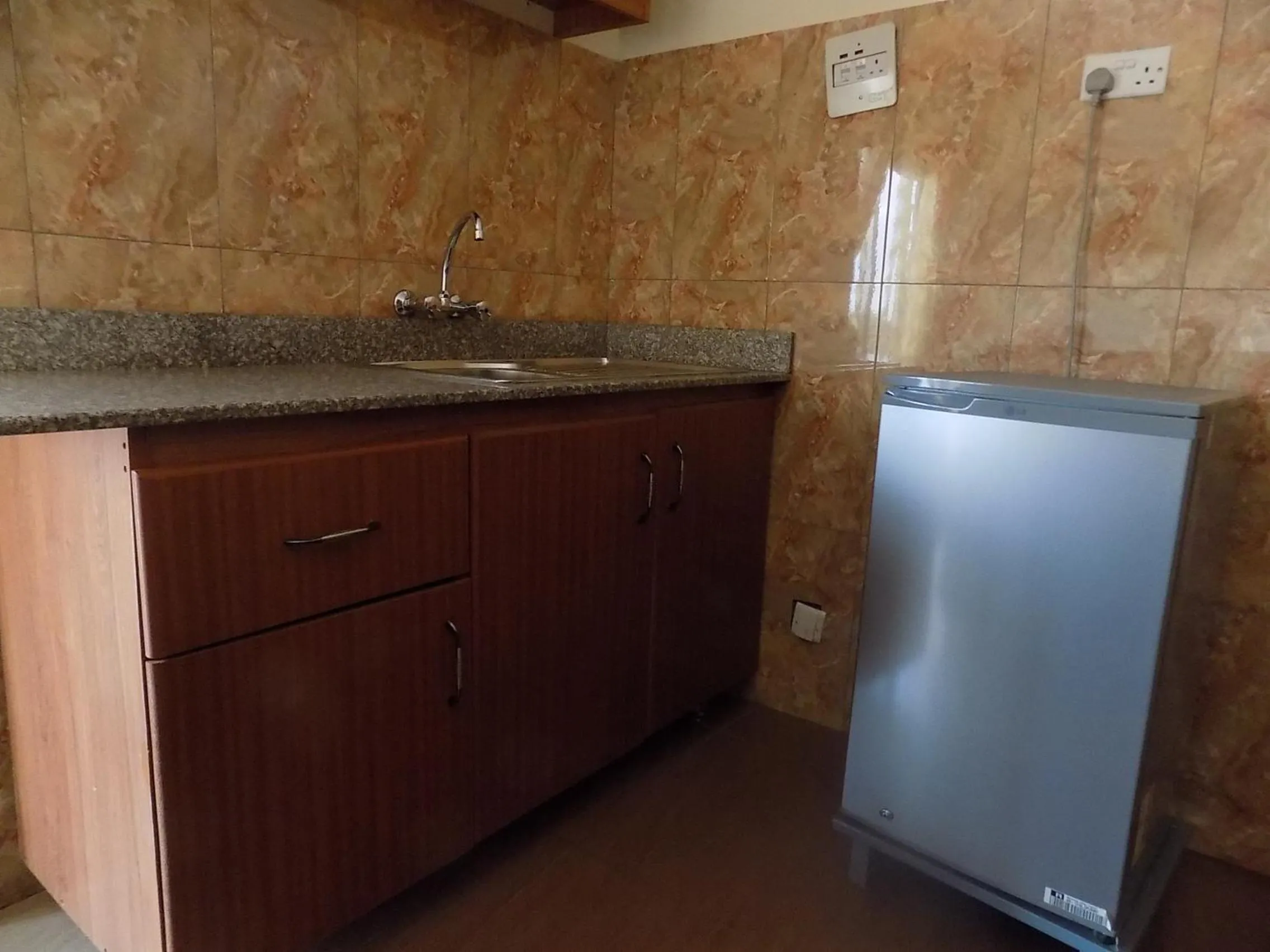 Kitchen or kitchenette in Olina Hotel and Apartments Kampala