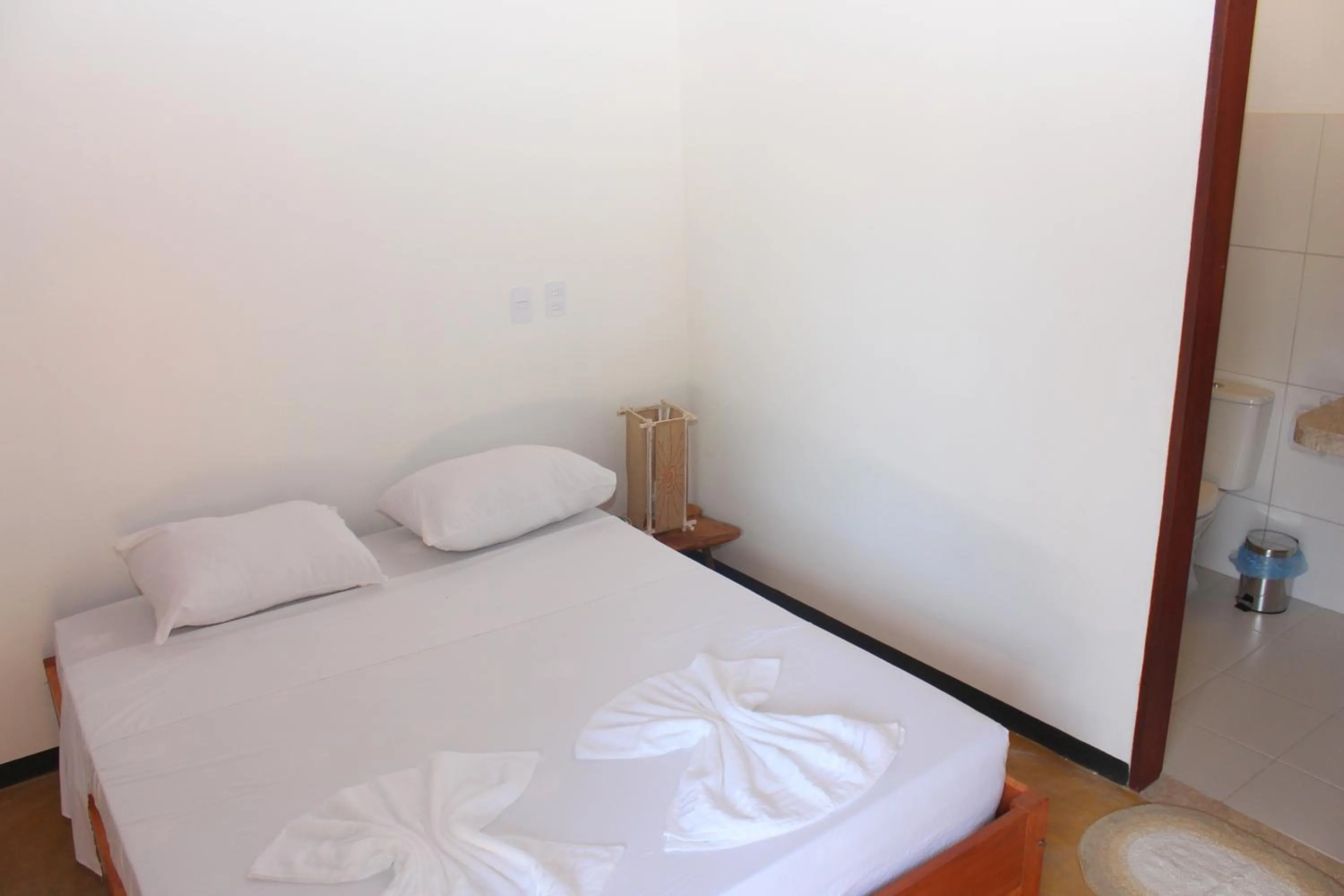 Bed in Pousada Paraíso dos Ipês