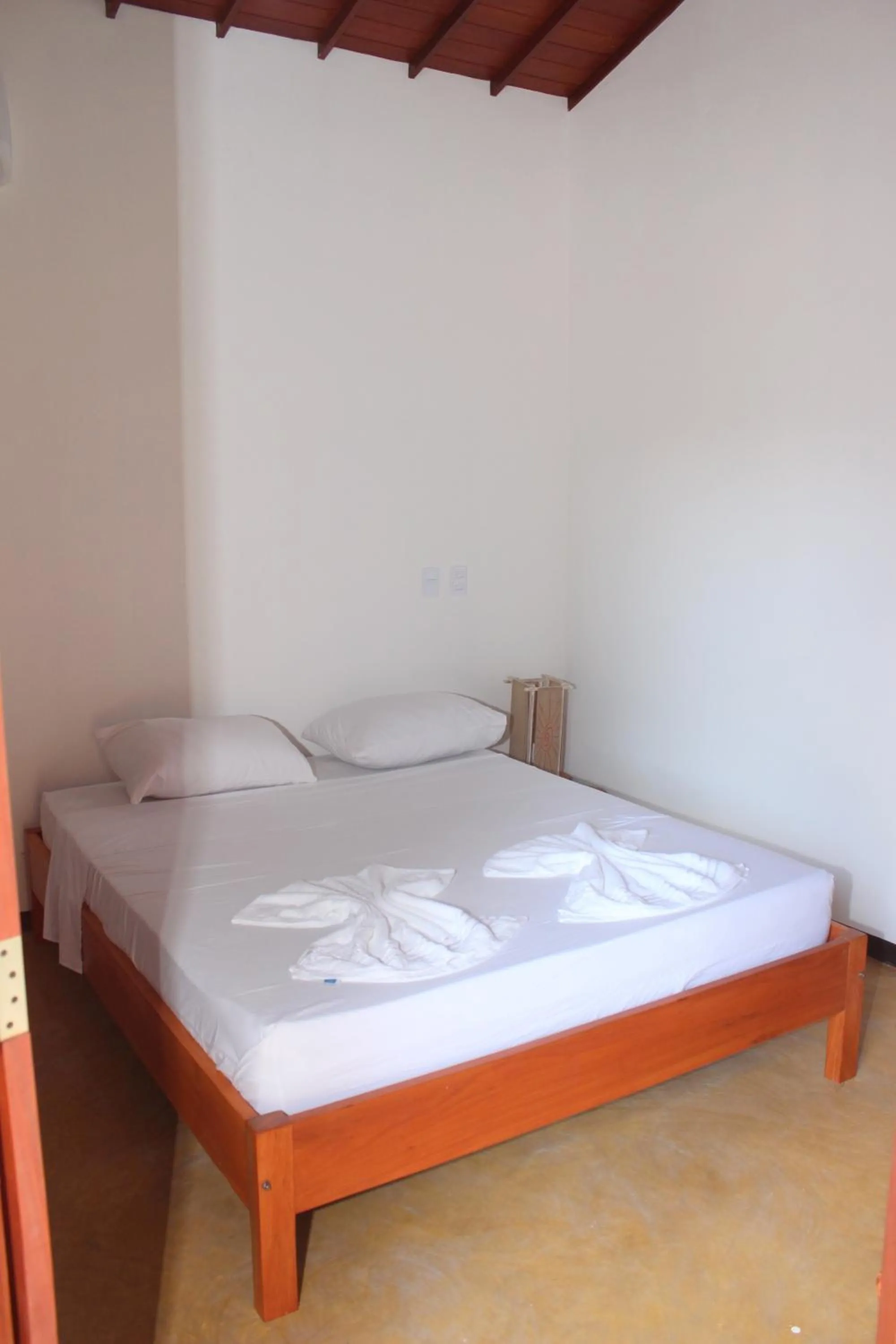 Bed in Pousada Paraíso dos Ipês