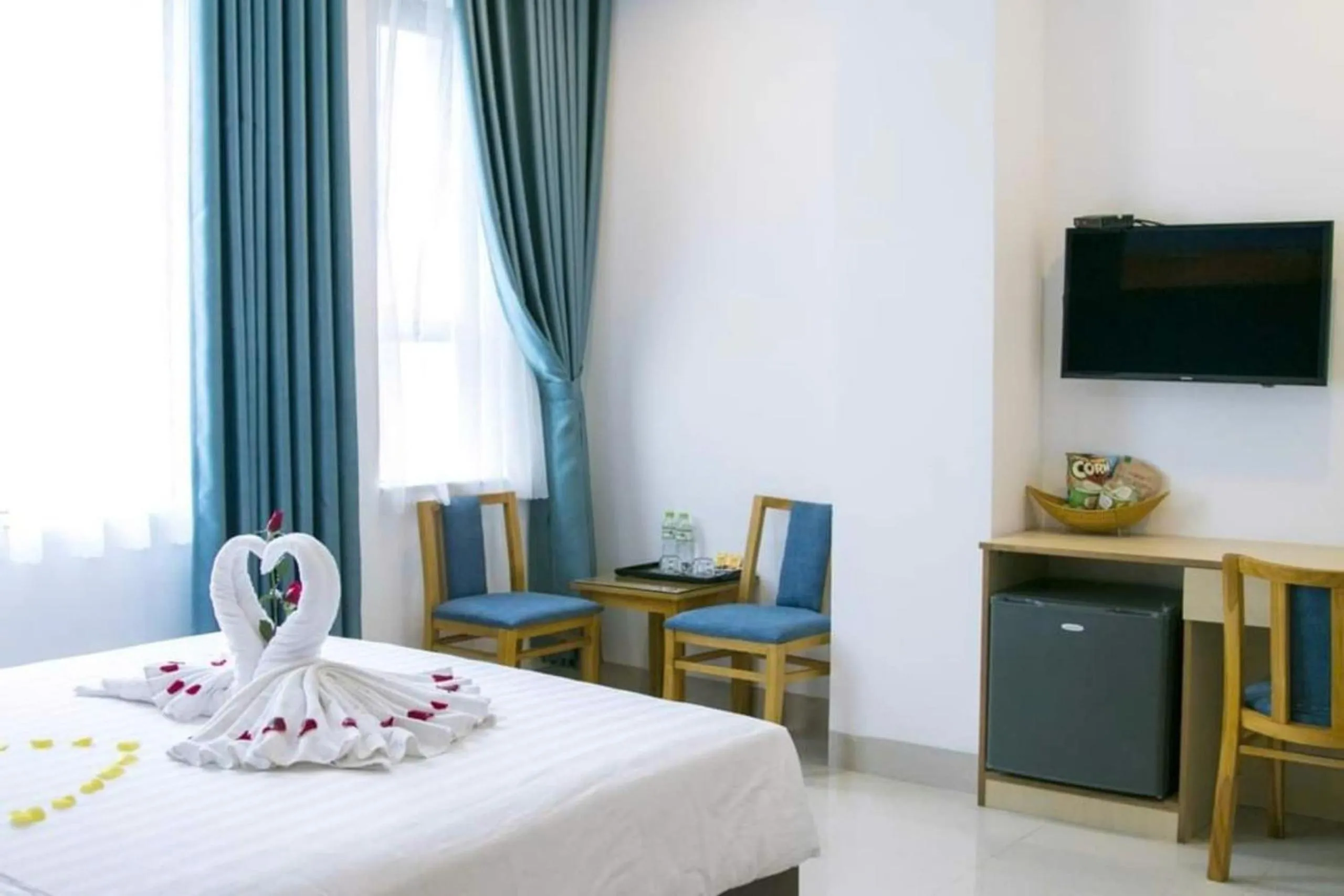 Bed in Maxhome Luxury Hotel