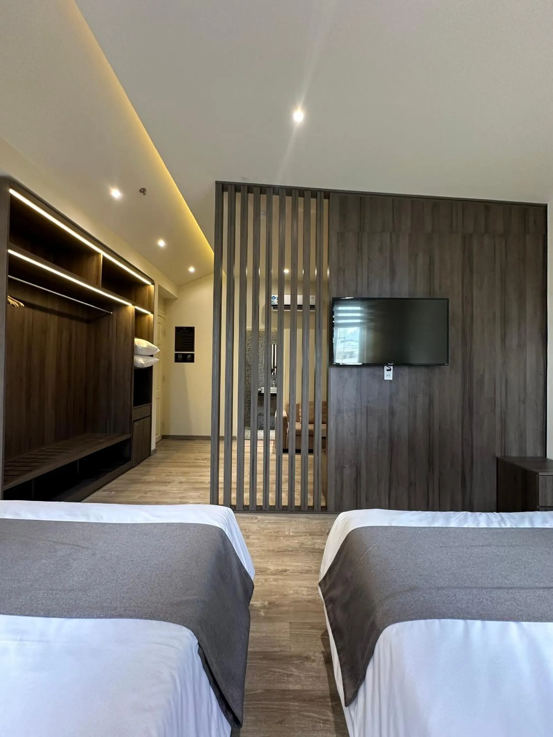 Communal lounge/ TV room, Bed in Hai Long Hotel