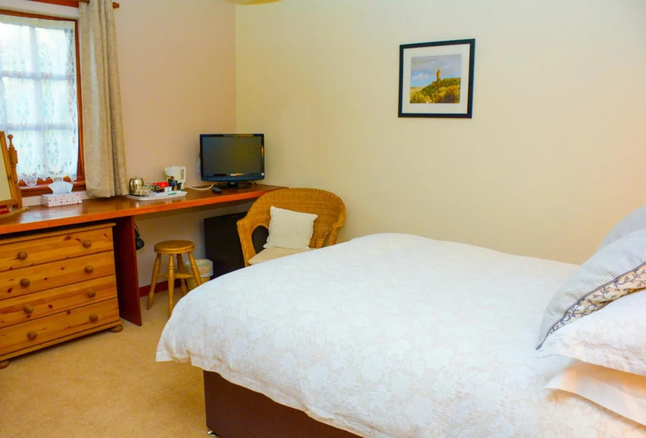 Bedroom, Bed in Clarke Cottage Guest House