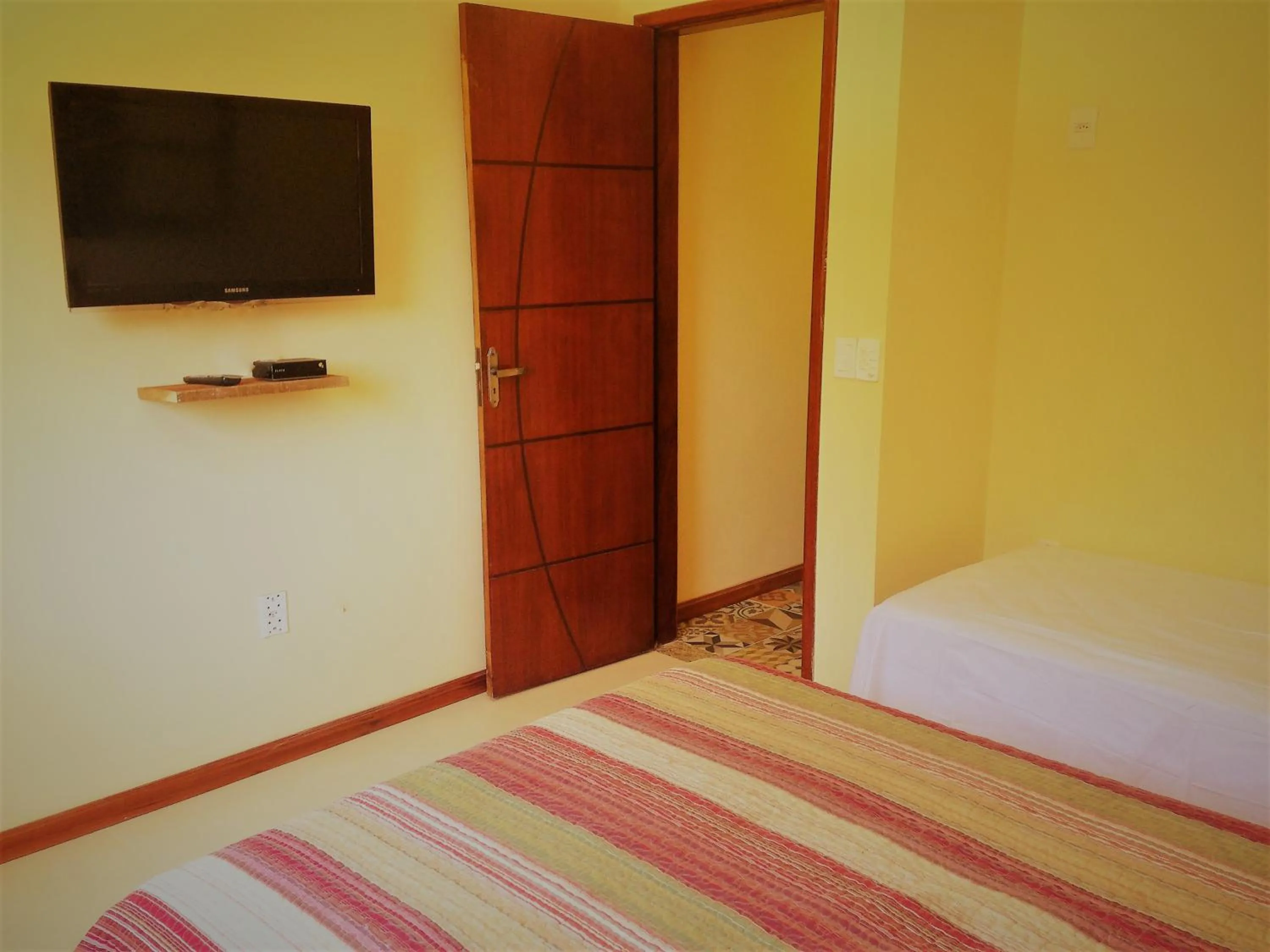 Photo of the whole room, Bed in Pousada Paraíso de Itaúna