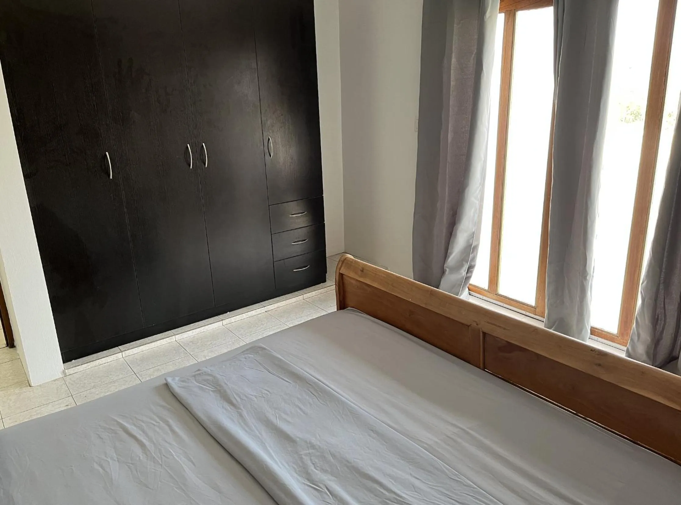 Bed in Genesis Apartments