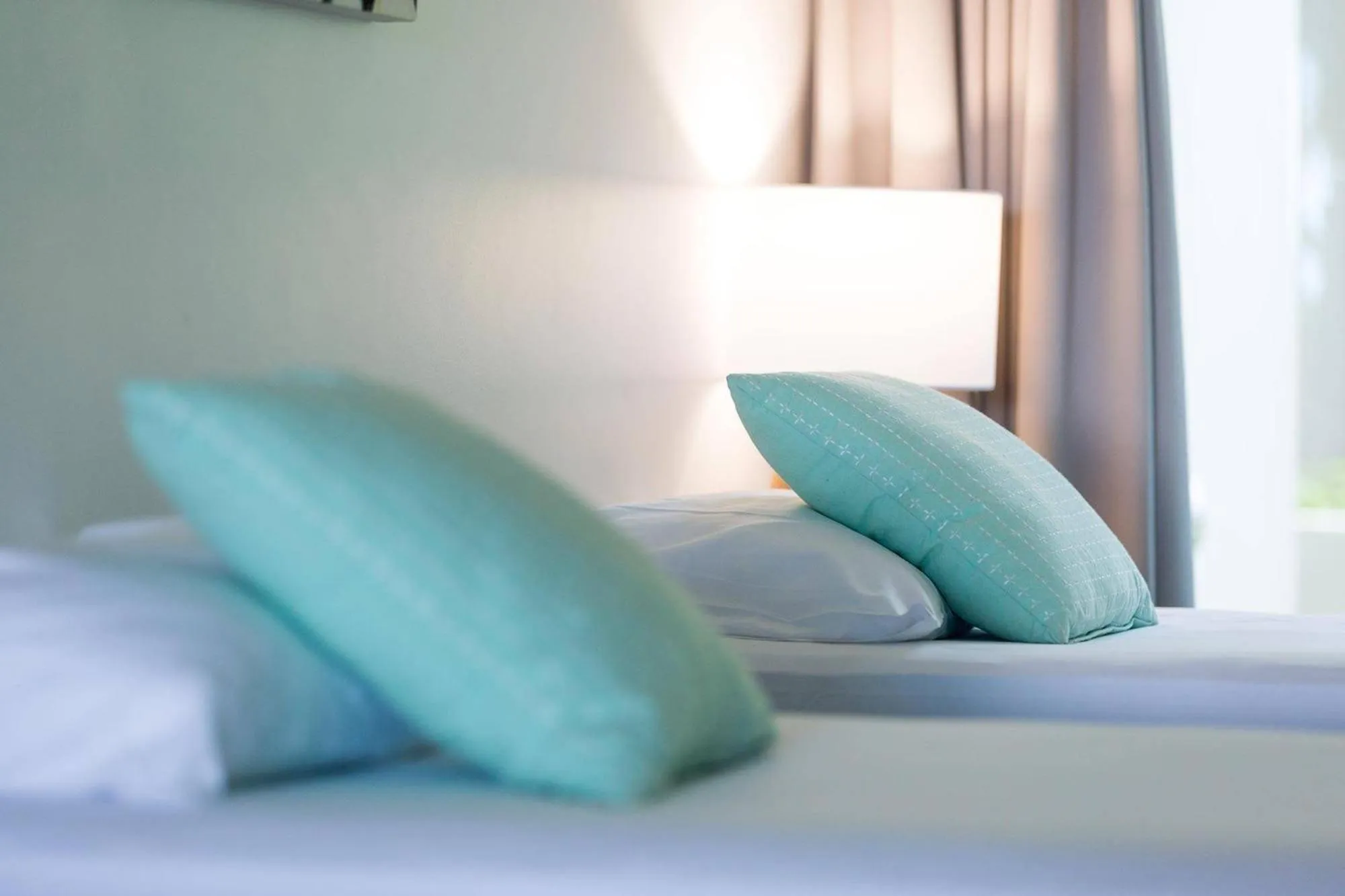 Bed in Azure Sea Whitsunday Resort