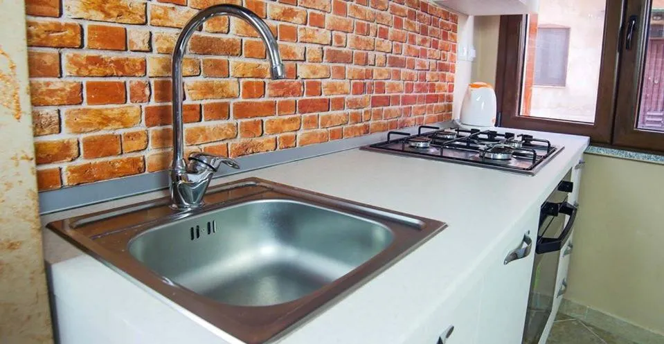 Kitchen or kitchenette in Alba Sarda Residence