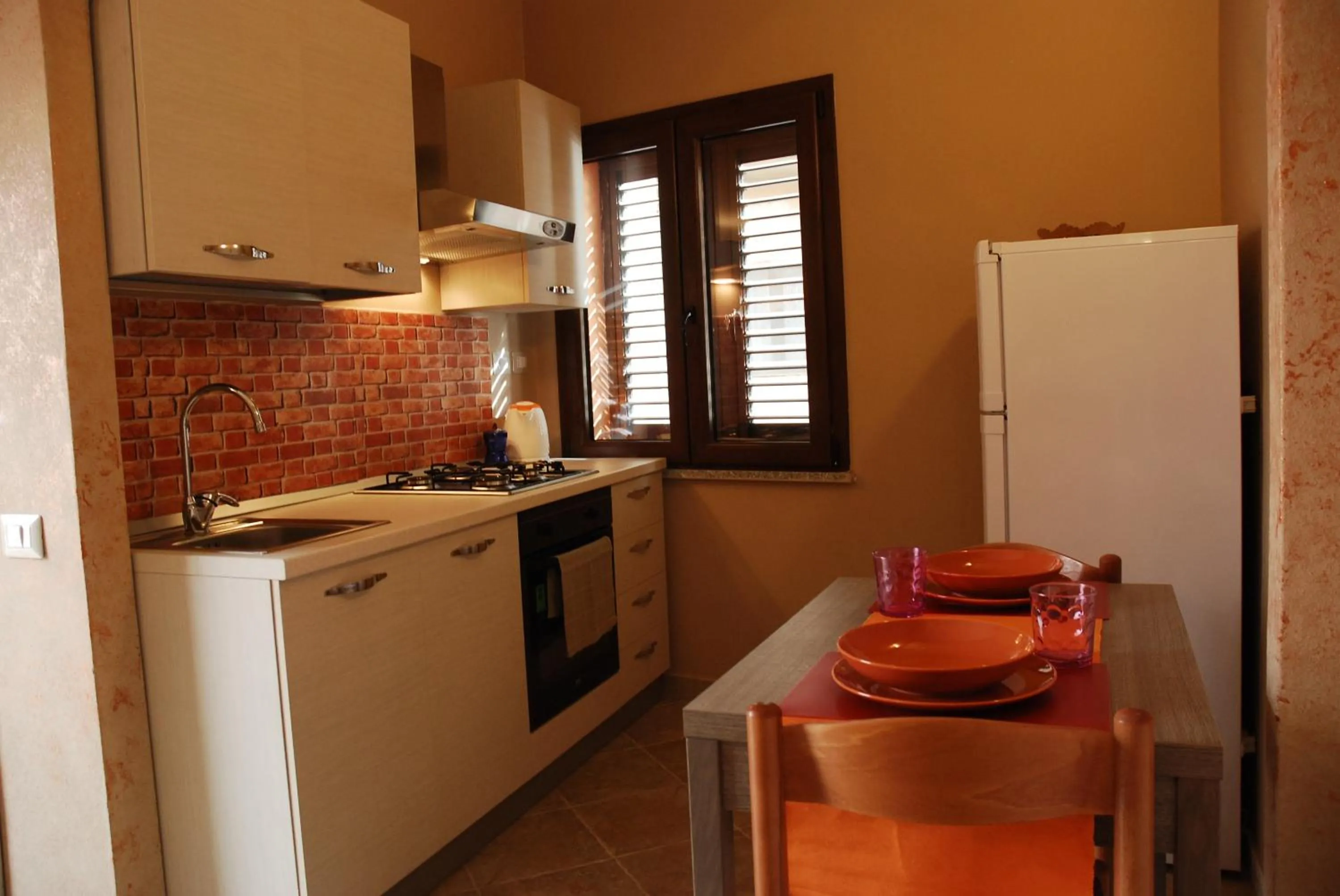 Kitchen or kitchenette in Alba Sarda Residence