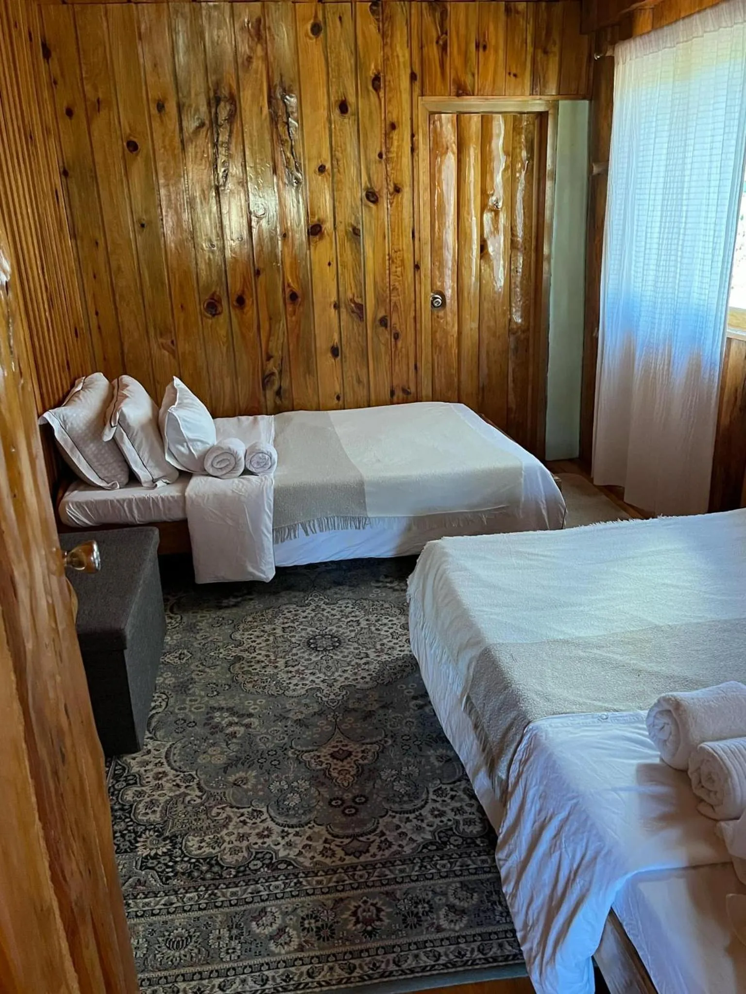 Bed in Agape Log Cabin