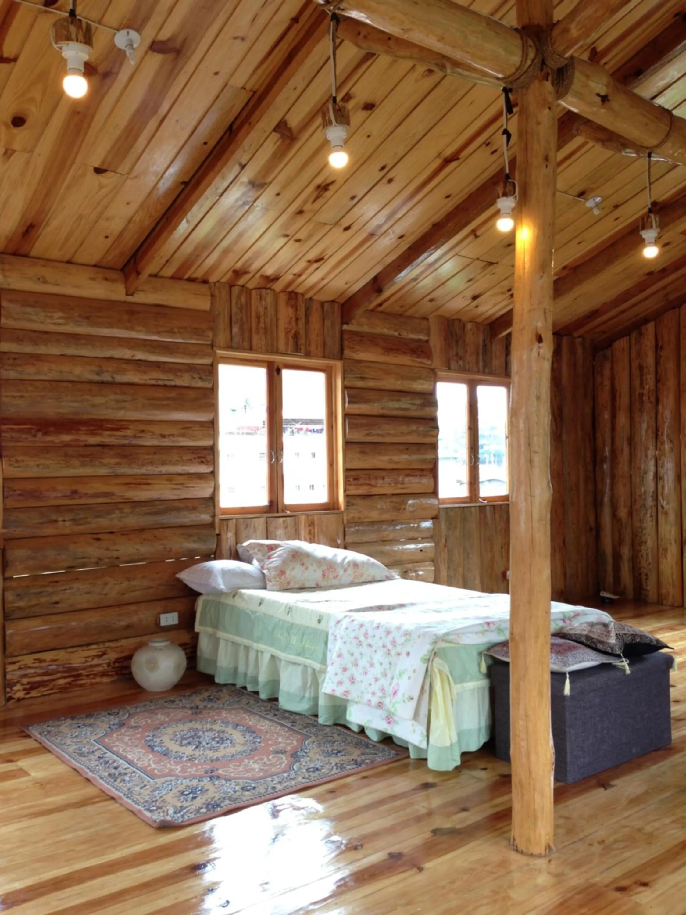 Photo of the whole room, Bed in Agape Log Cabin