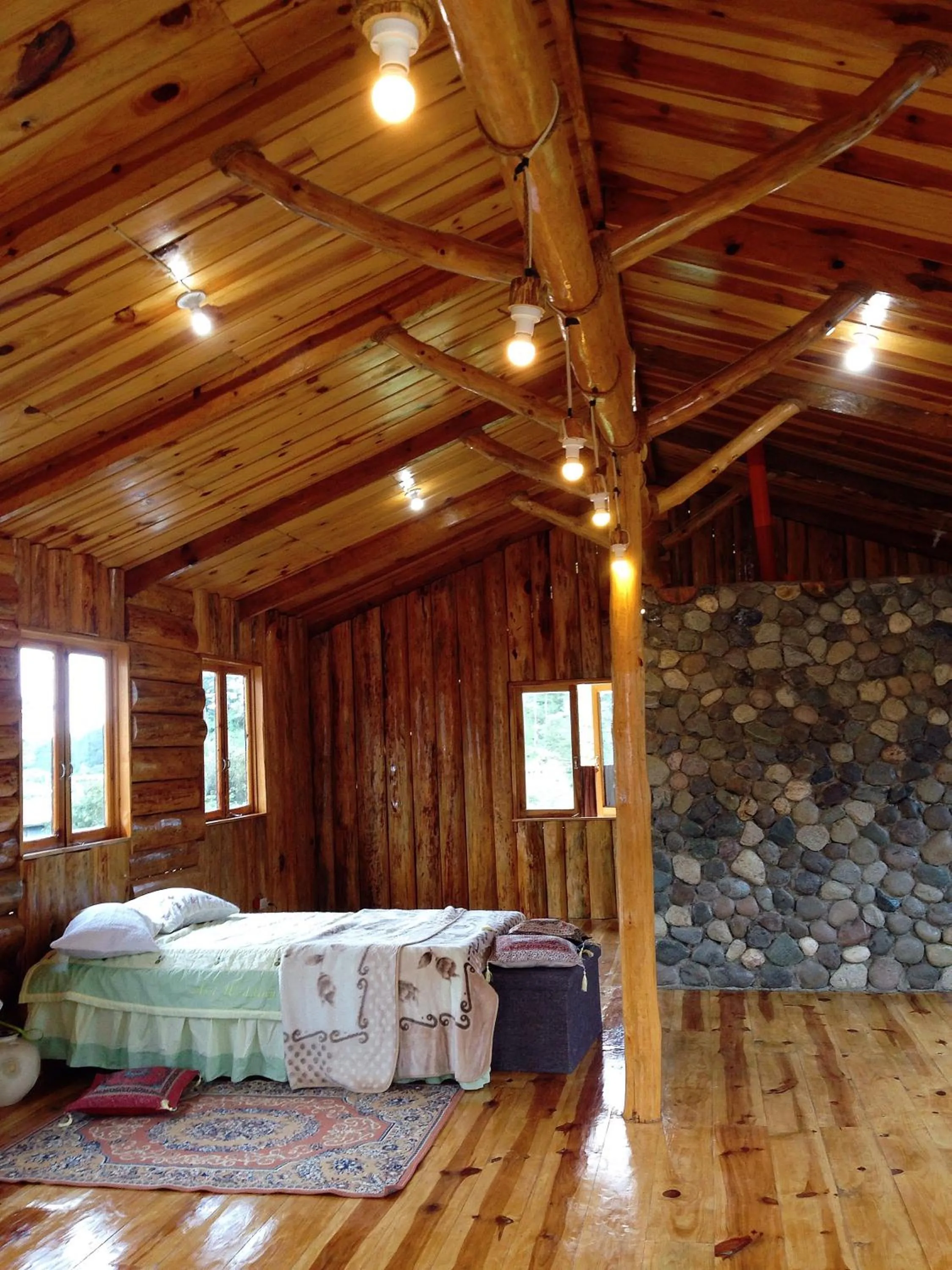 Photo of the whole room, Bed in Agape Log Cabin