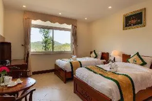 Bed in Thuy Hoang Nguyen Resort & Spa