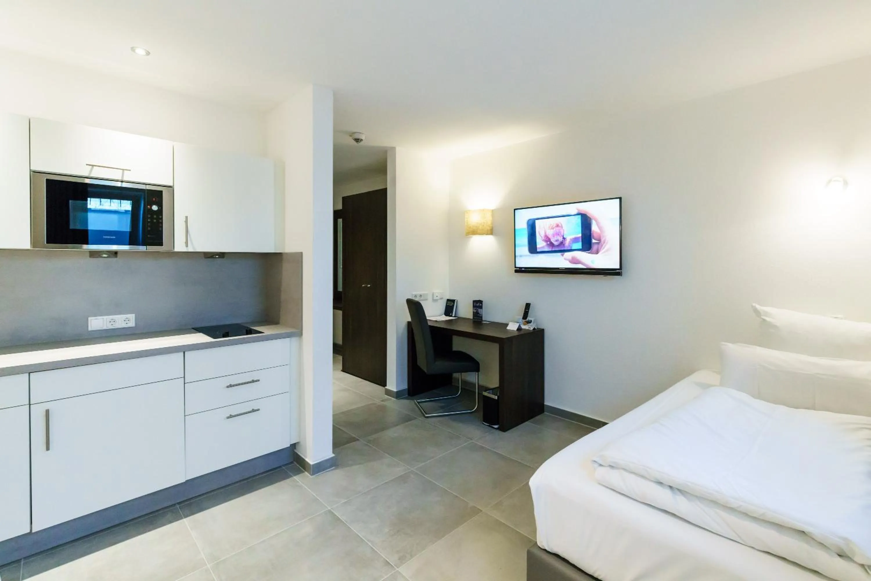 Kitchen or kitchenette, Bed in Hotel Duda Langenbruck