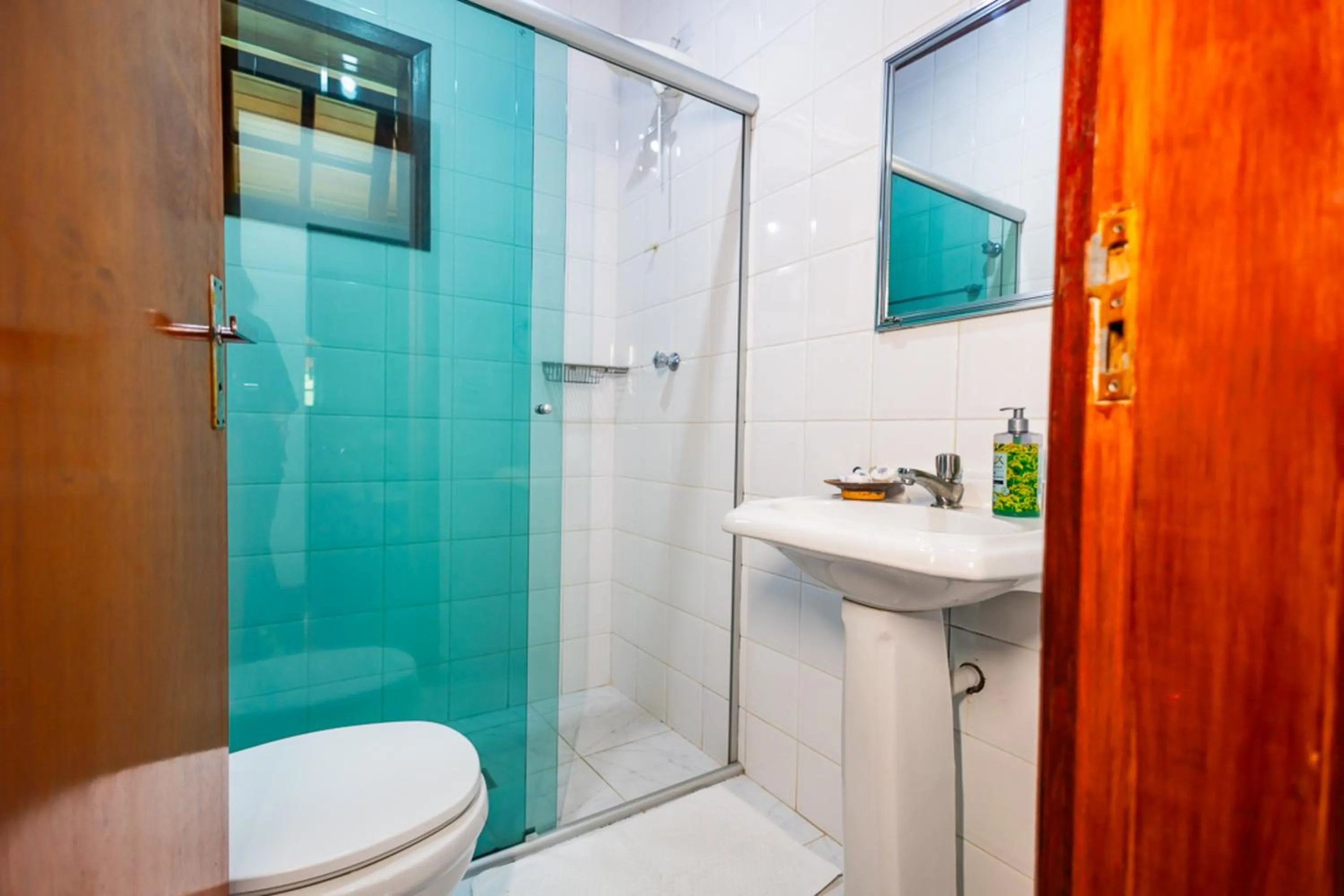 Bathroom in Putini Pousada e Hotel by OYO