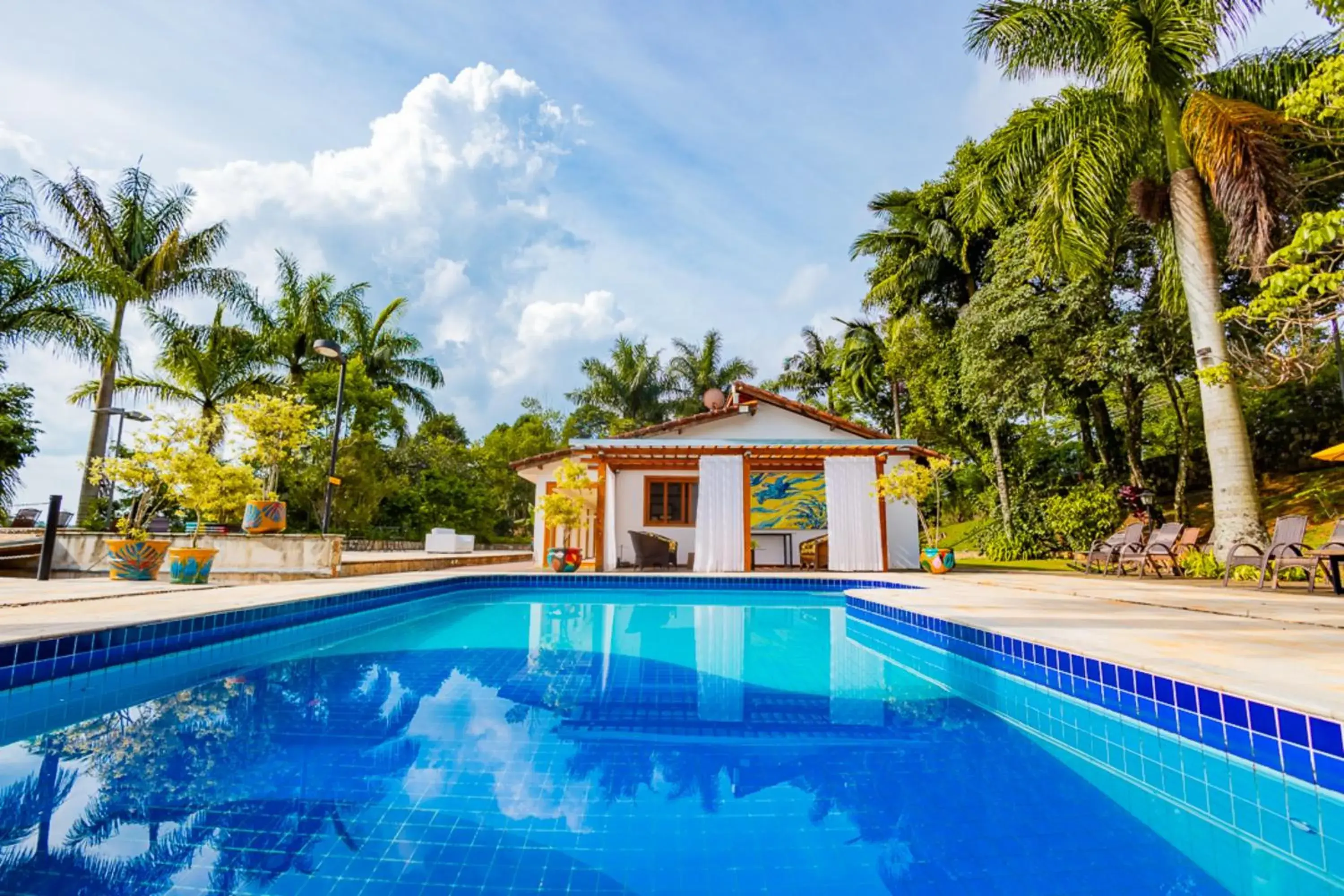 Swimming pool in Putini Pousada e Hotel by OYO Swimming pool in Putini Pousada e Hotel by OYO