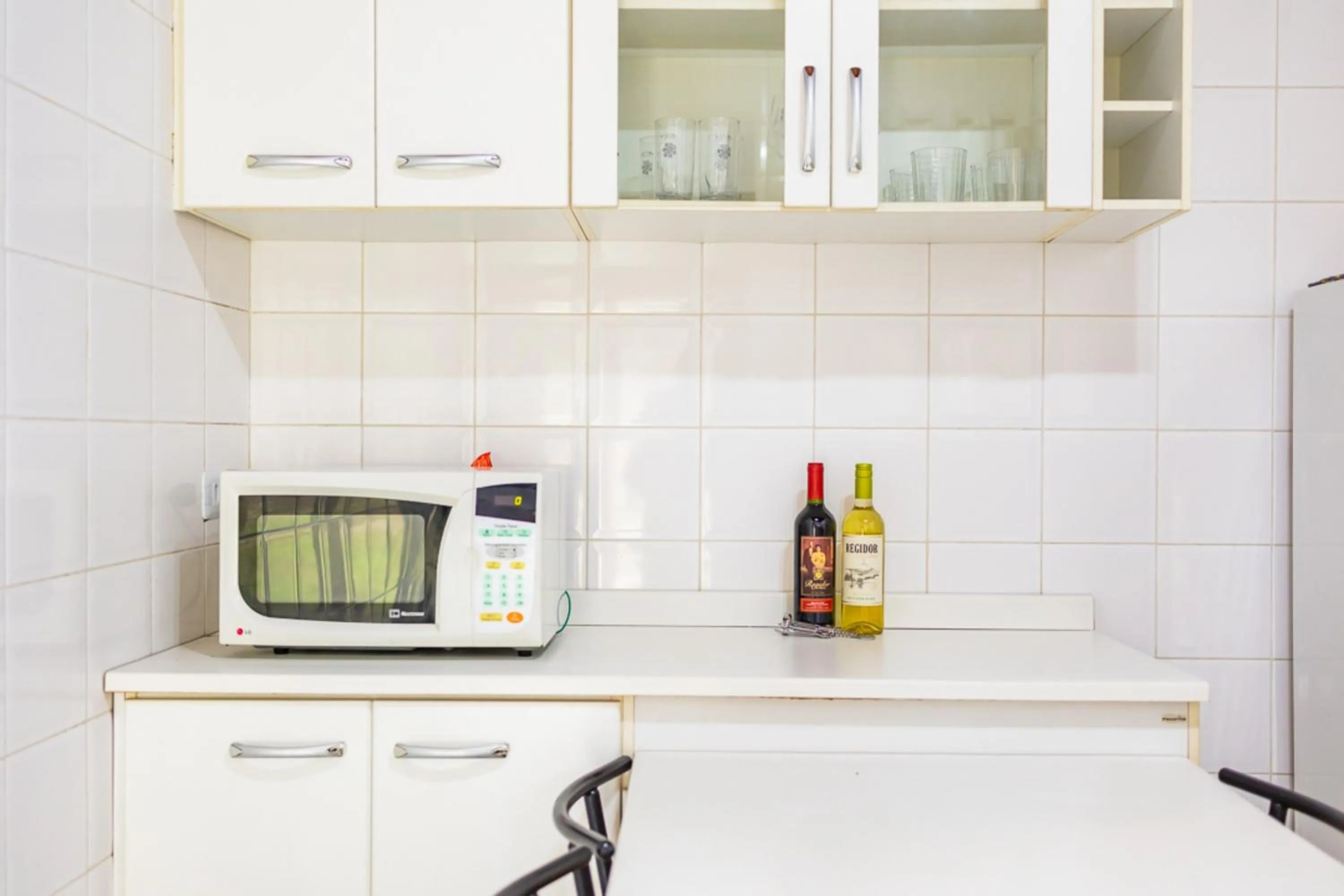 Kitchen or kitchenette in Putini Pousada e Hotel by OYO