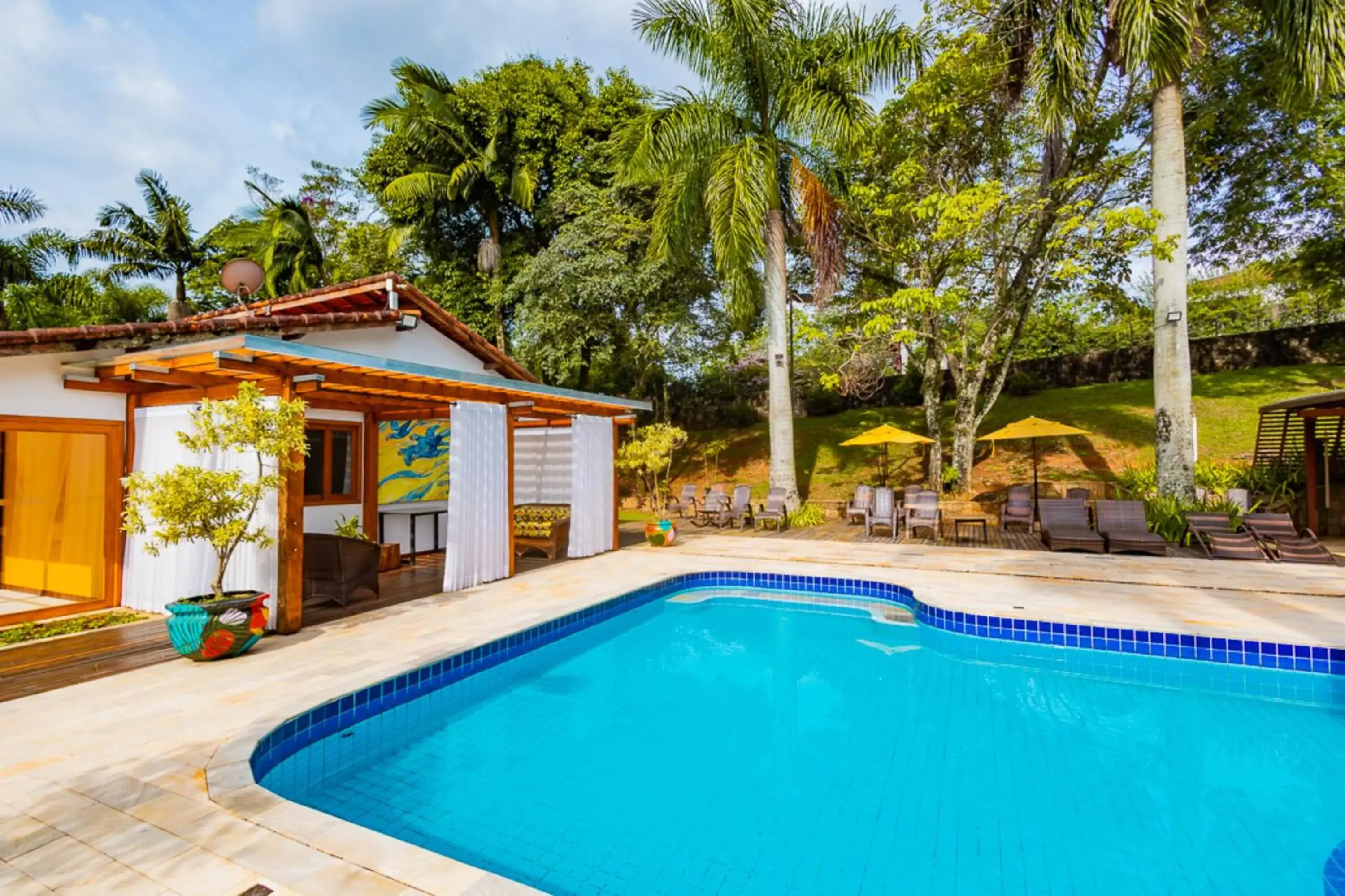 Swimming pool in Putini Pousada e Hotel by OYO Swimming pool in Putini Pousada e Hotel by OYO