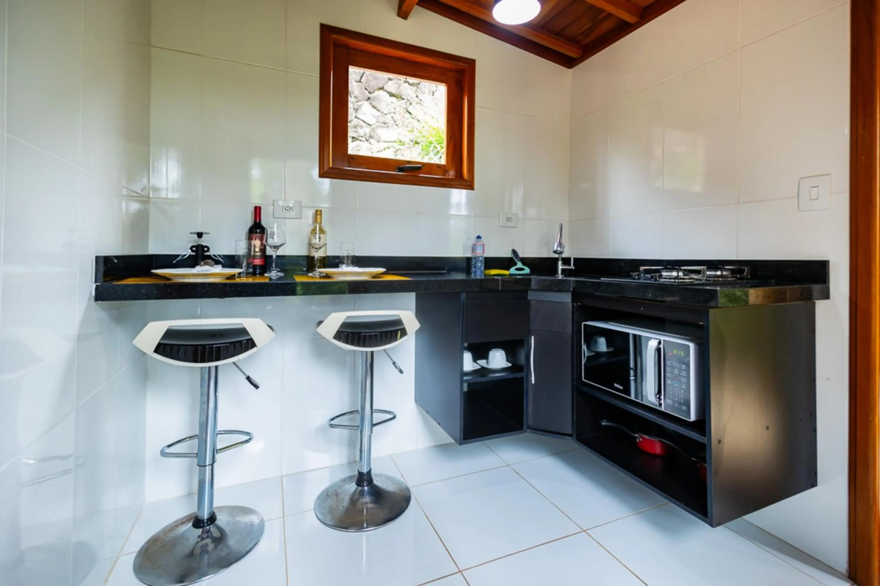 Kitchen or kitchenette in Putini Pousada e Hotel by OYO