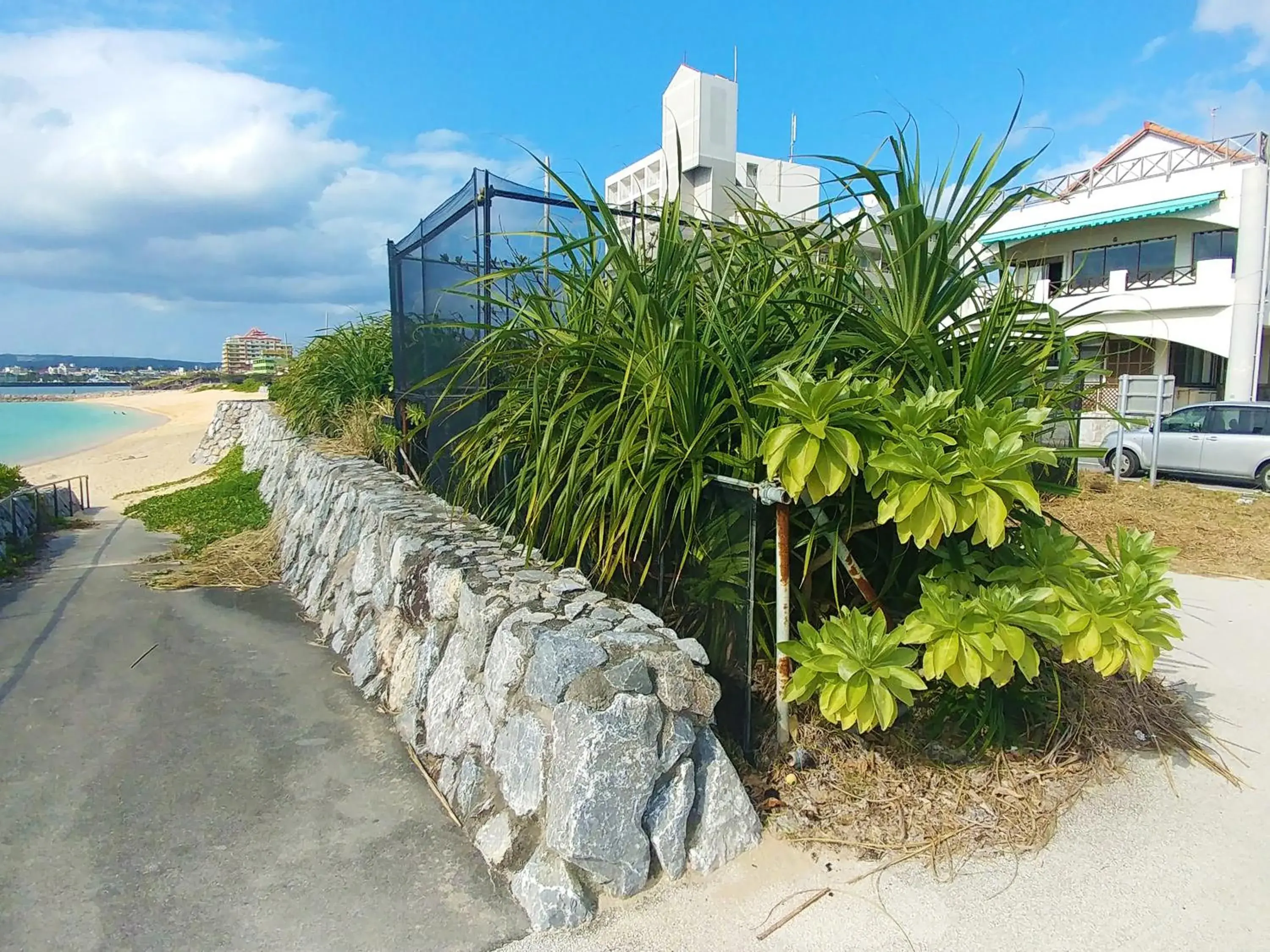 Property building in Kariyushi Condominium Resort Sea Side House Property building in Kariyushi Condominium Resort Sea Side House