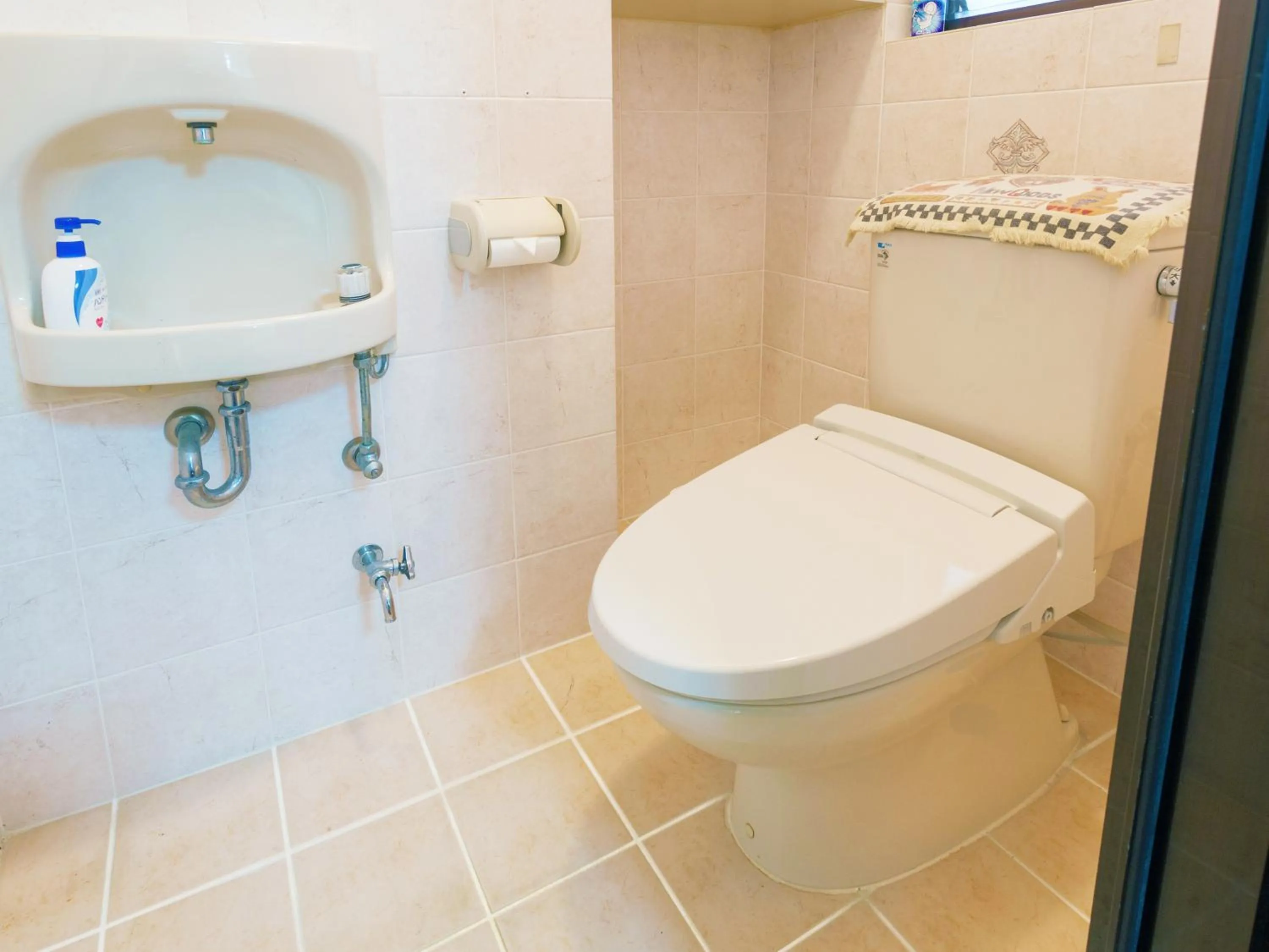 Toilet in Kariyushi Condominium Resort Sea Side House