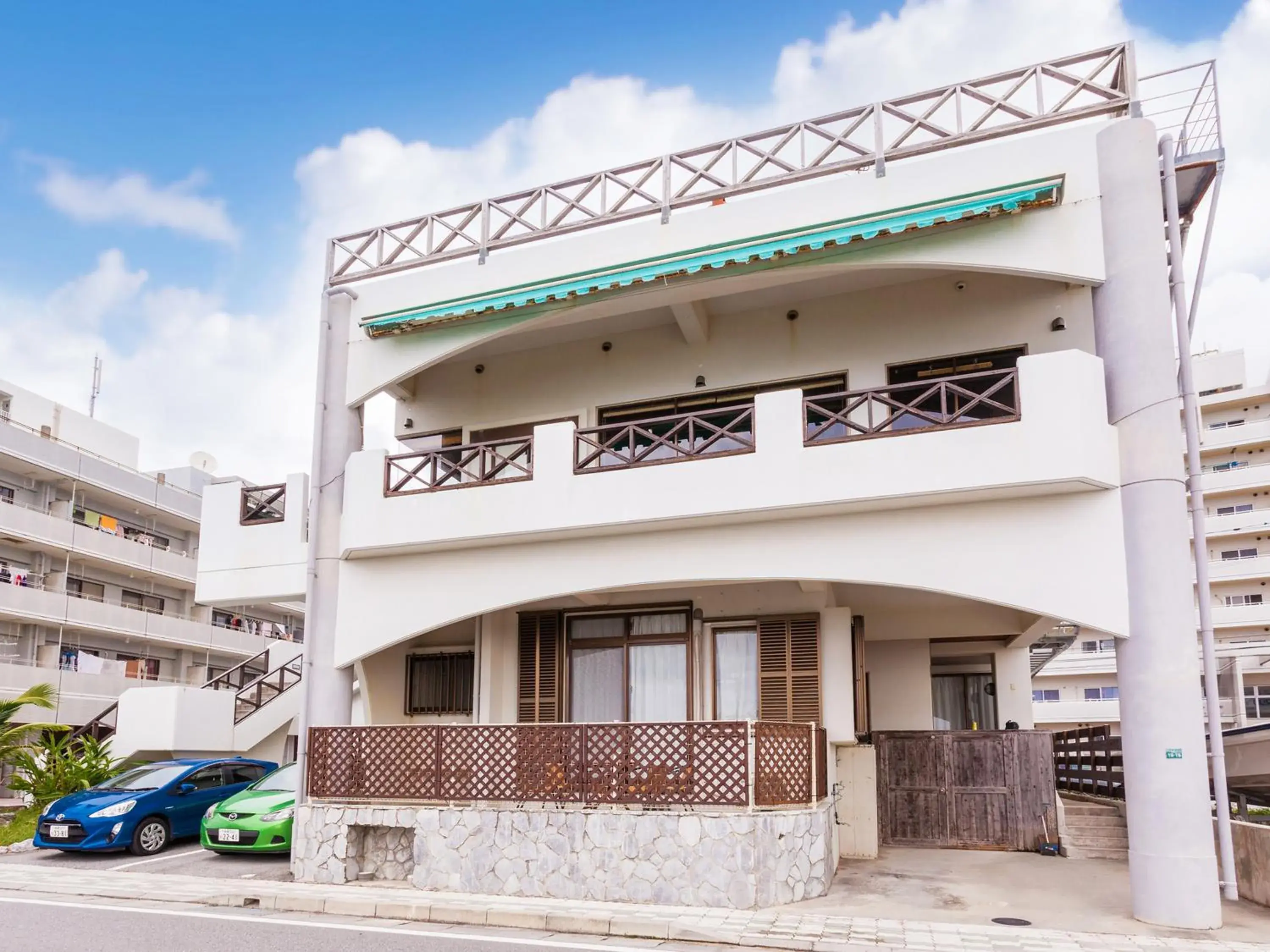 Property building in Kariyushi Condominium Resort Sea Side House Property building in Kariyushi Condominium Resort Sea Side House